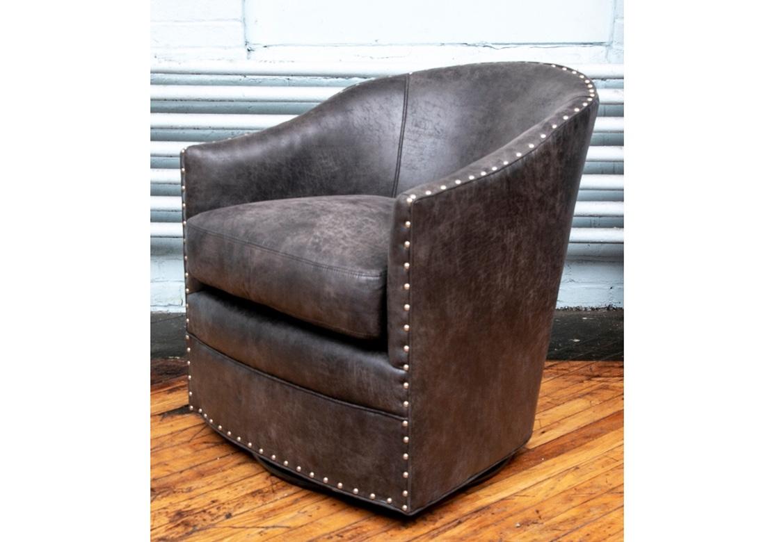Group of four fine mottled gray-brown Leather Club Chairs by Arhaus with sloping arms and silver tone nail-head trim on the outside frame. 
Measures: H. 30 1/2