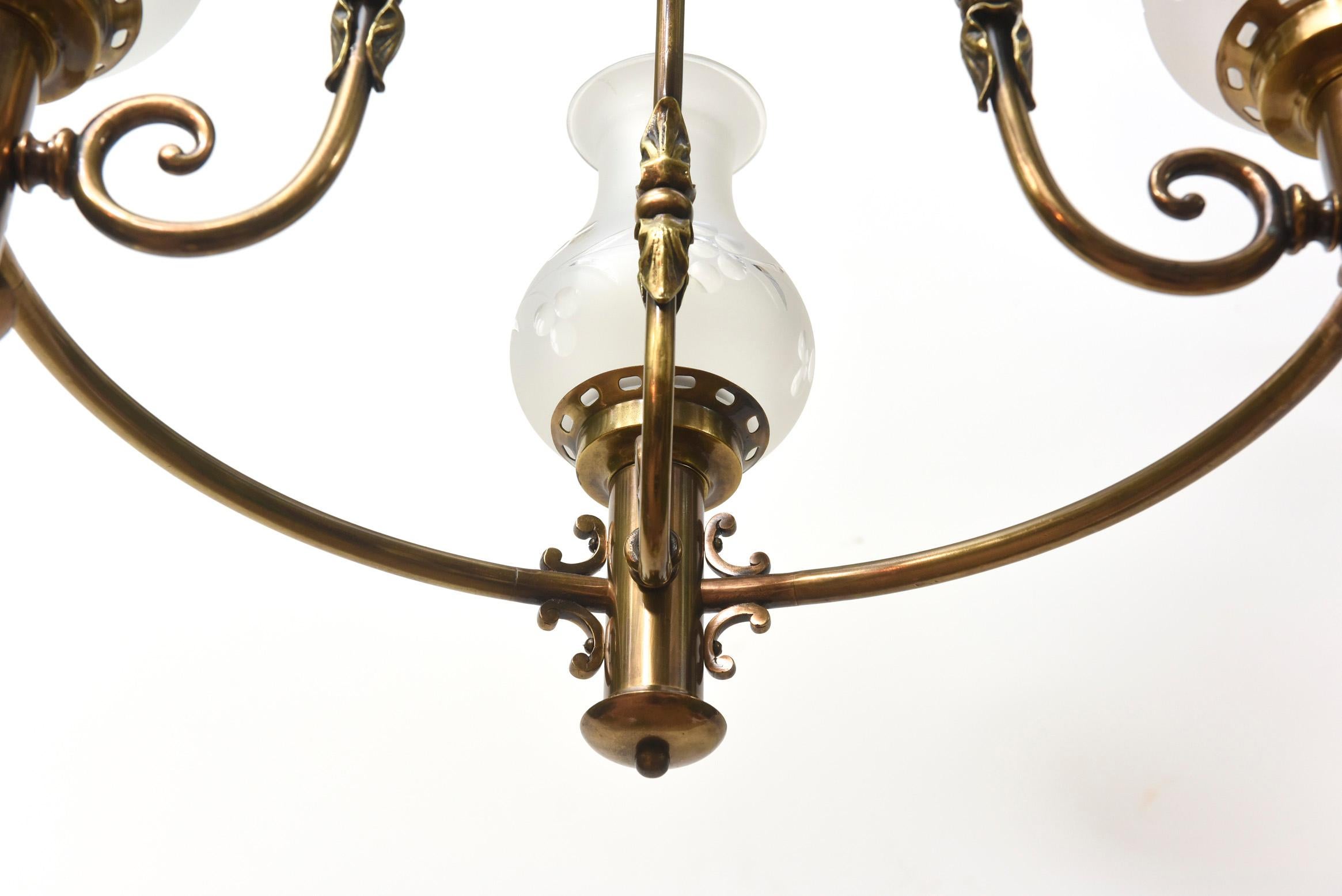Four Light Colonial Revival Argand Oil Style chandelier. Original Glass. Completely restored and rewired. Ready to hang. Antique brass patina finish. American, C. 1915

Dimensions: 
Height: 28