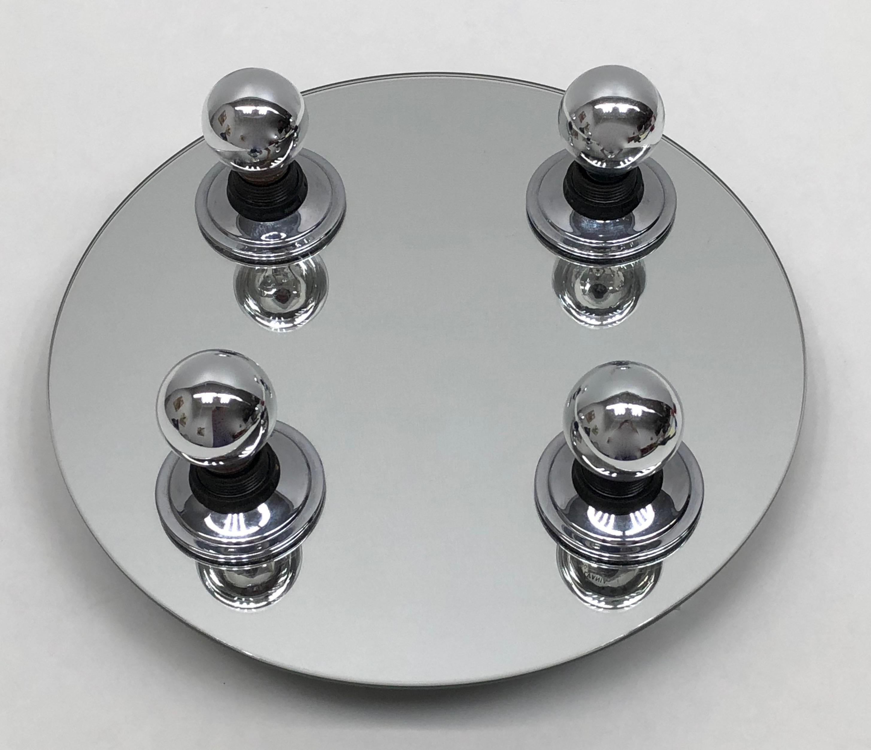 Elegant German modern wall light, with chrome base on a mirror and mounted on white lacquered metal. Manufactured by Fischer Leuchten in the 1980s. This fixture requires four European E14 lightbulbs, up to 40 watts each. Lightbulbs pictured are not