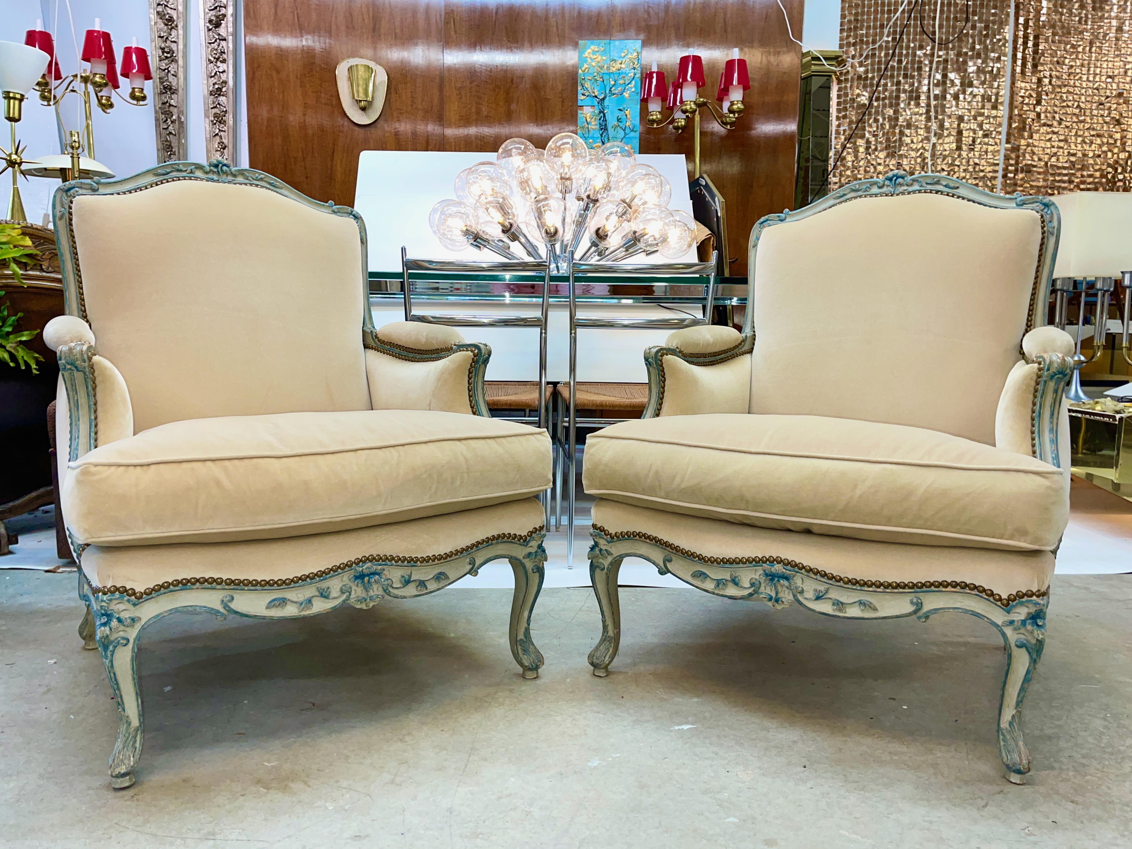 A pair of Louis XV provincial style blue/gray painted bergeres upholstered in cream colored mohair with brass nailhead trim.
Price shown is per pair.
We believe these came from Trouvailles, Boston and are the Ernie chair by Meyer Gunther