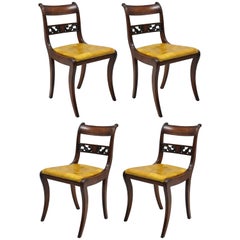 Four Mahogany Carved Plume & Acanthus Regency Style Saber Leg Dining Side Chairs