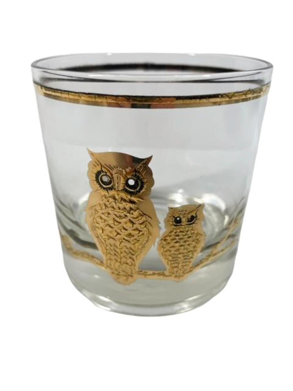 Set of 4 mid-century modern rocks glasses by Culver decorated in 22k gold over raised black enamel with two owls perched on a branch and signed Culver, LTD.