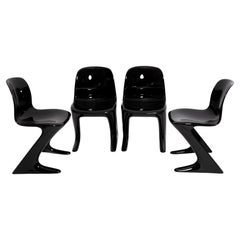 Quatre chaises Kangourou noires du milieu du siècle conçues par Ernst Moeckl, Allemagne, années 1960