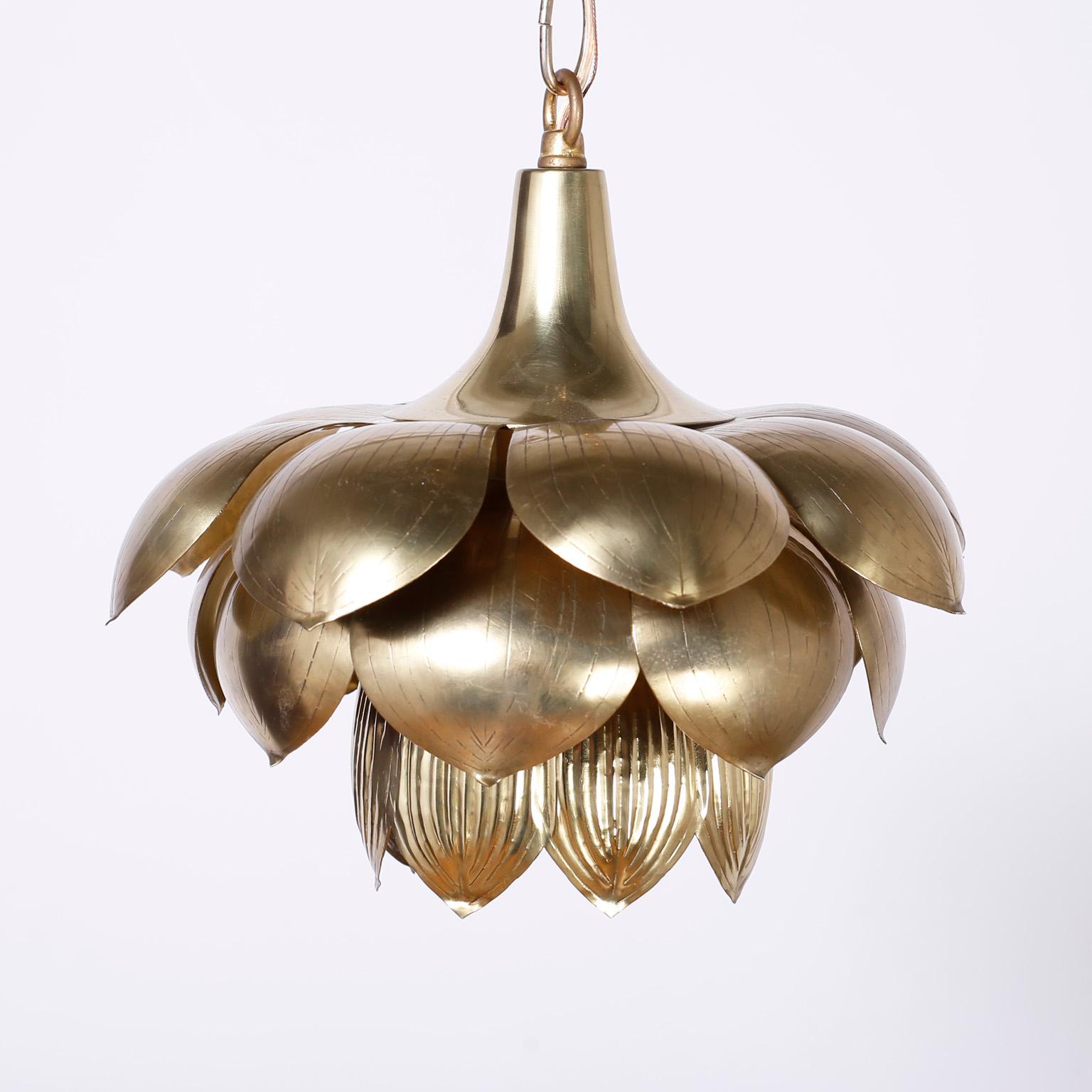 Chic set of three mid century lotus pendants with an exotic ambiance, crafted in brass and hand polished and lacquered for easy care. Priced individually.