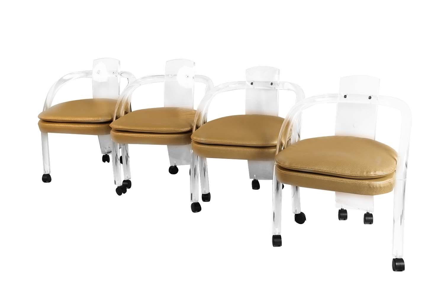 An amazing set of 4 vintage Mid-Century Modern tubular Lucite chairs, in the style of Charles Hollis Jones. Great modern form, featuring a tubular Lucite frame with a barrel backrest. Detailed raised soft padded, seat cushions, in original neutral