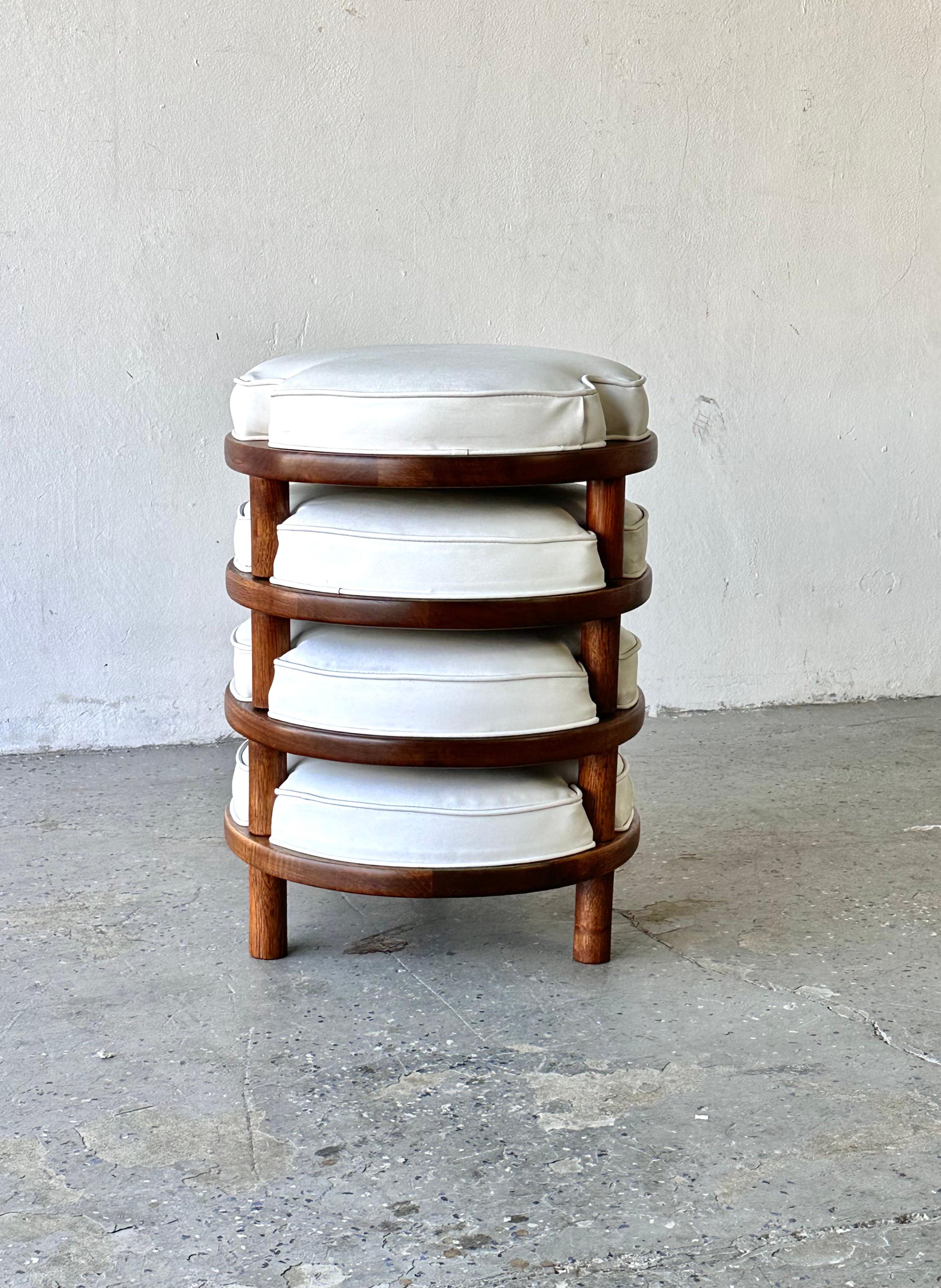 
Harvey Probber-Style Walnut Stacking Stools, Ottomans or Footstools

with original naugahyde upholstery raised on three turned supports.

Group total 25 inches high  

Individual 18.25 wide by 18.25, wide, 8.5 inches high 

Wood has been