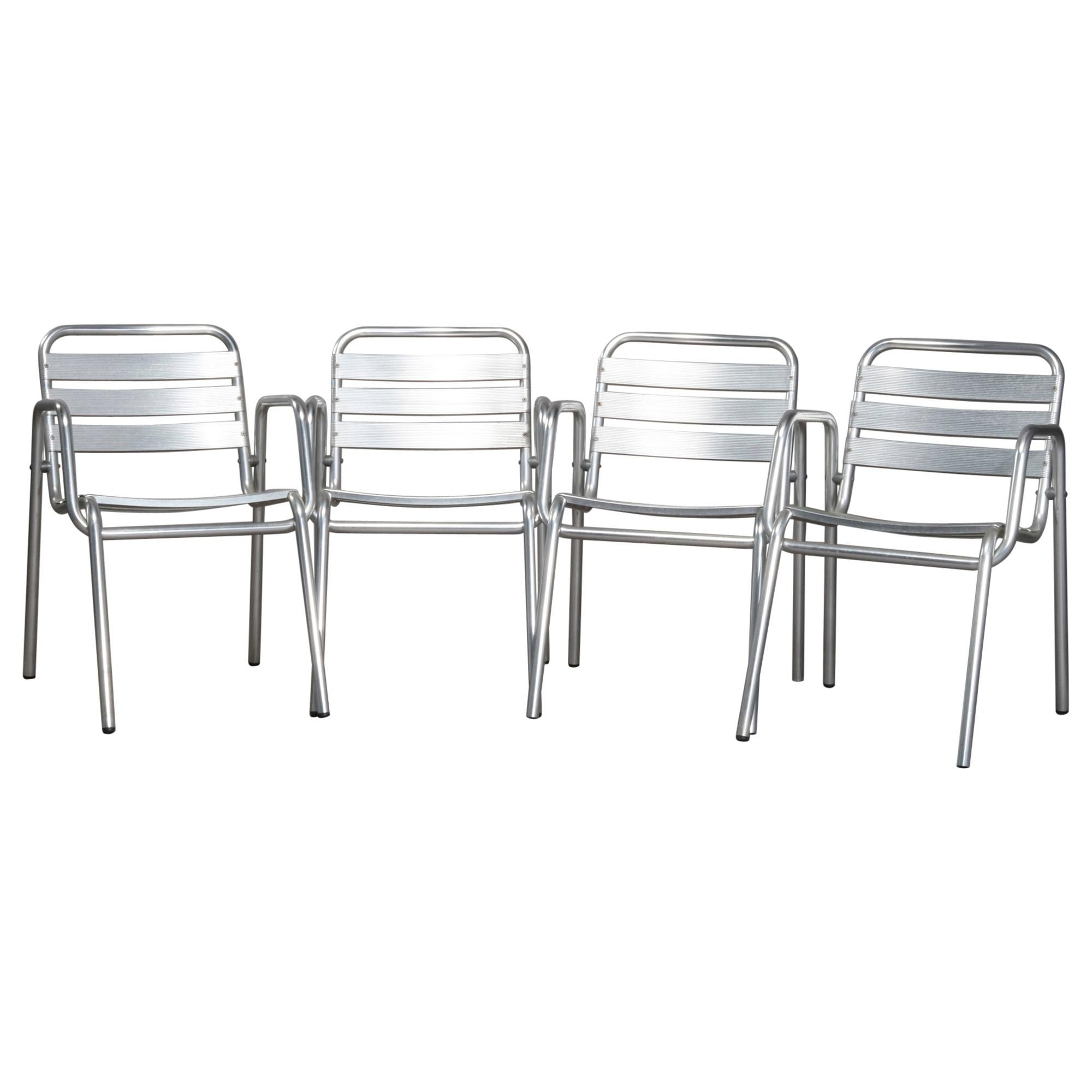 Four Mid-Century Modern Stacking Aluminum Banded Armchairs, circa 1960