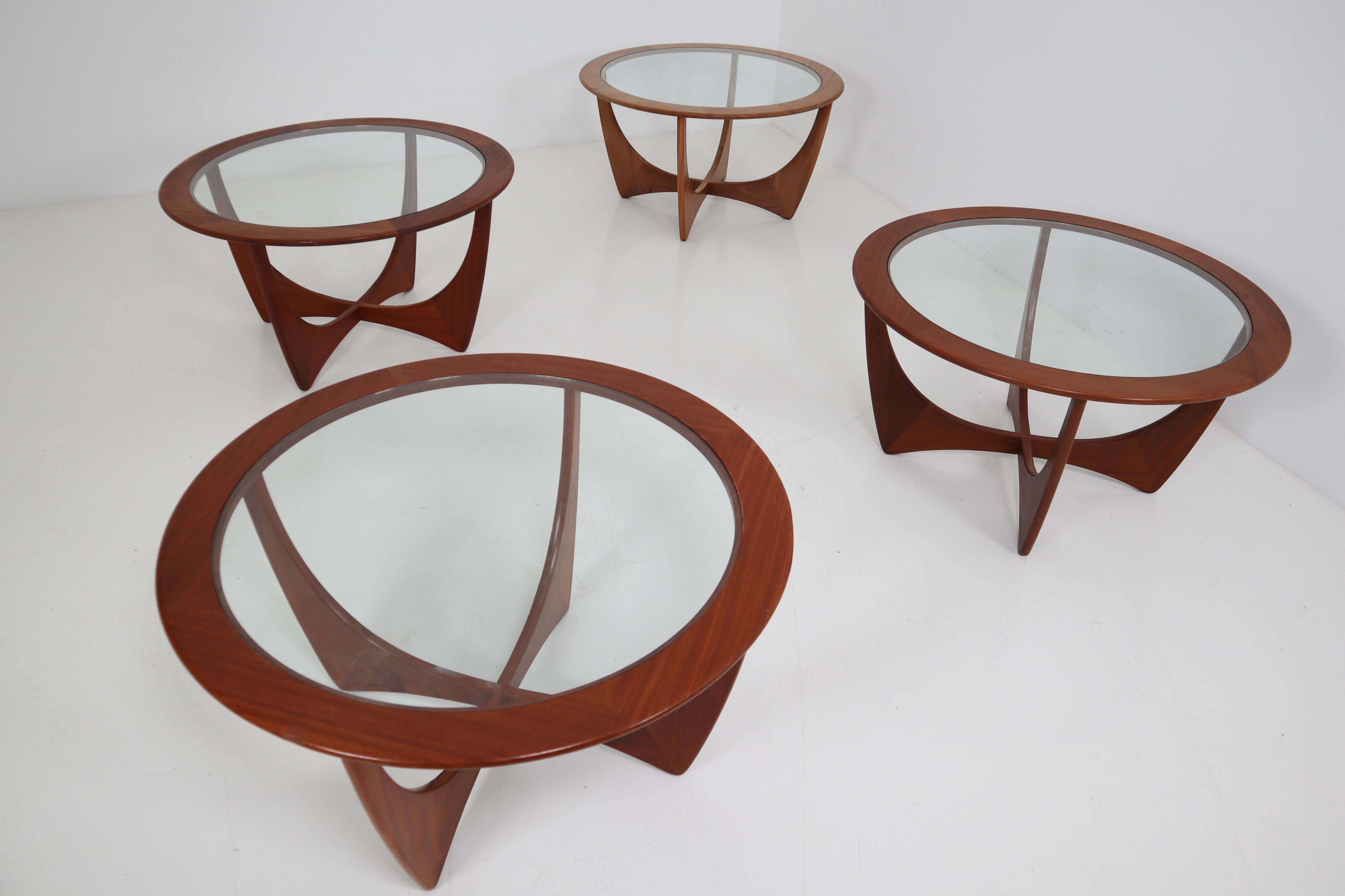 Four lovely tables of Afromosia wood with glass tops was designed by V.B. Wilkins as part of his Astro line for G-Plan. The scale makes them suitable for use as either end tables or coffee tables. England, circa 1960s. Excellent vintage
