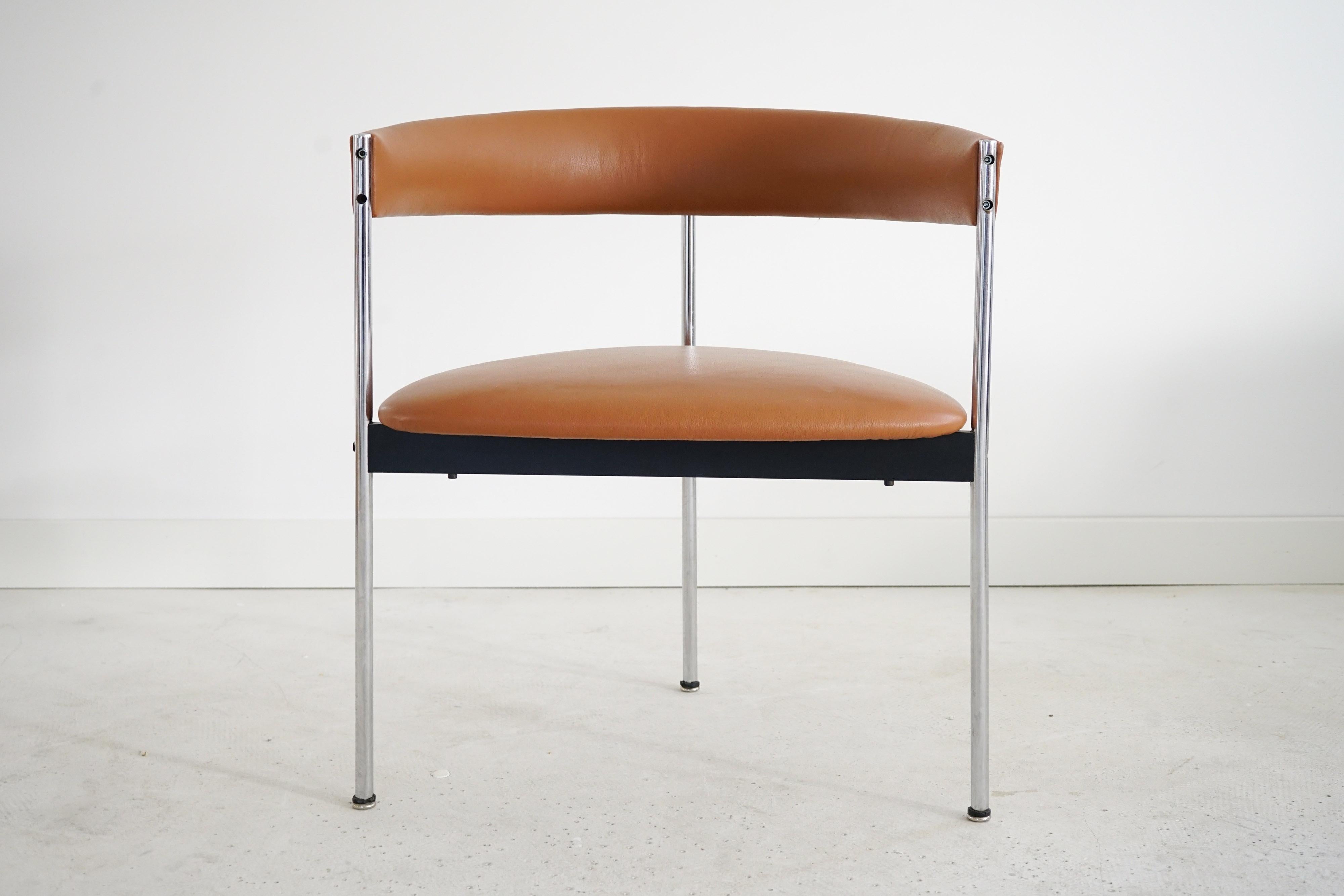 Three-legged chairs by Dieter Wäckerlin for Idealheim, 1970s. Set of four chairs. The chairs with chrome-plated frames have been newly upholstered and are covered with cognac-colored leather. They are in very good condition.