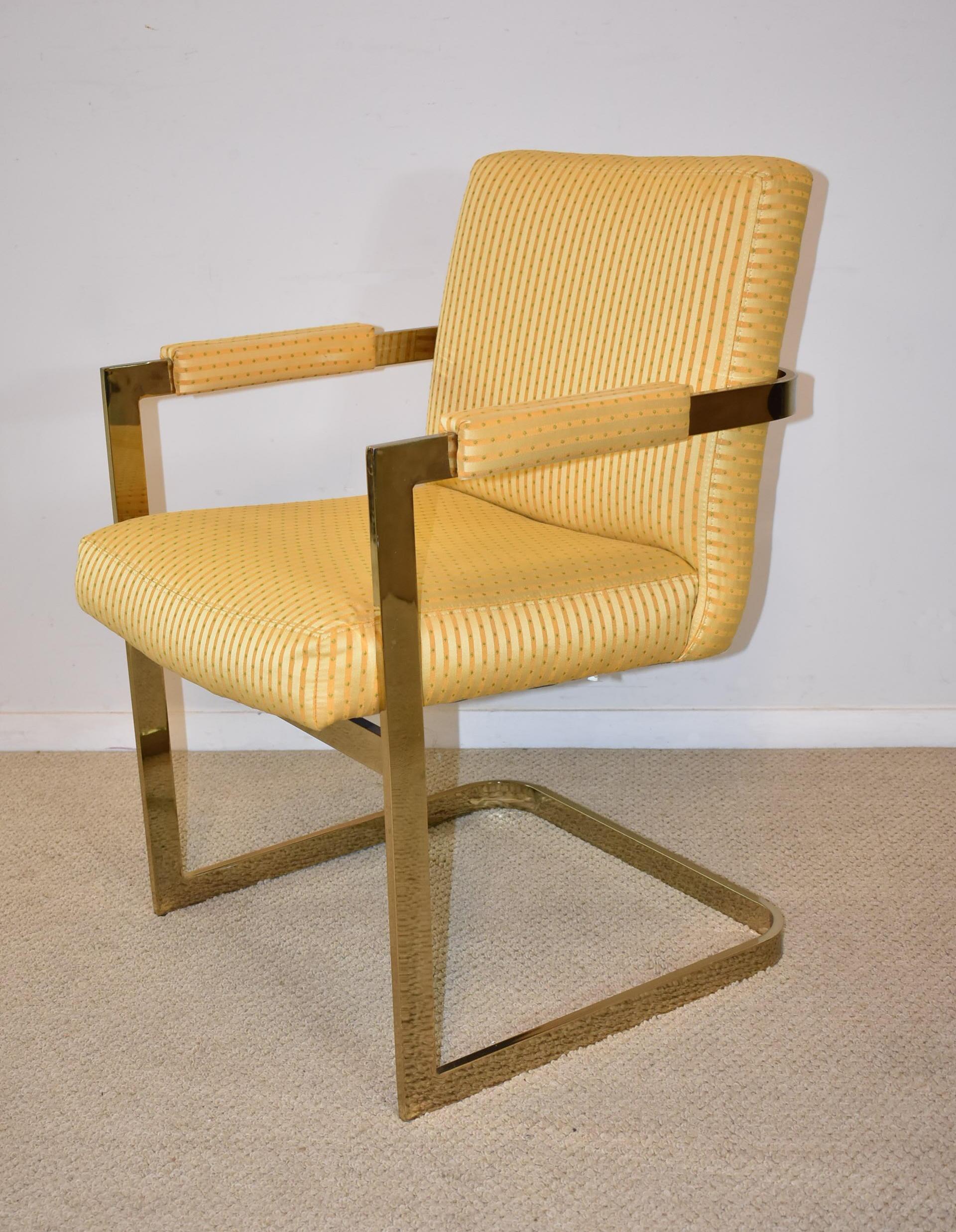 Four vintage, circa 1970s Milo Baughman flatbar cantilever armchairs. Brass frame with upholstered seat, back and arms.