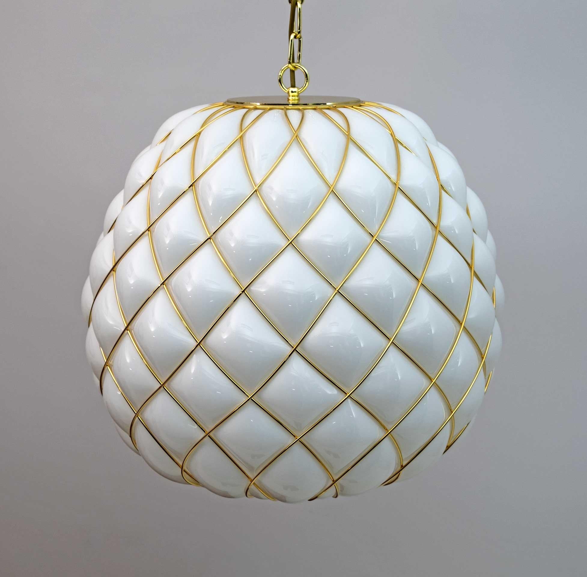 Late 20th Century Four Modern Brass and Caged Murano Glass Large Pendant Lamps by Fontana Arte For Sale