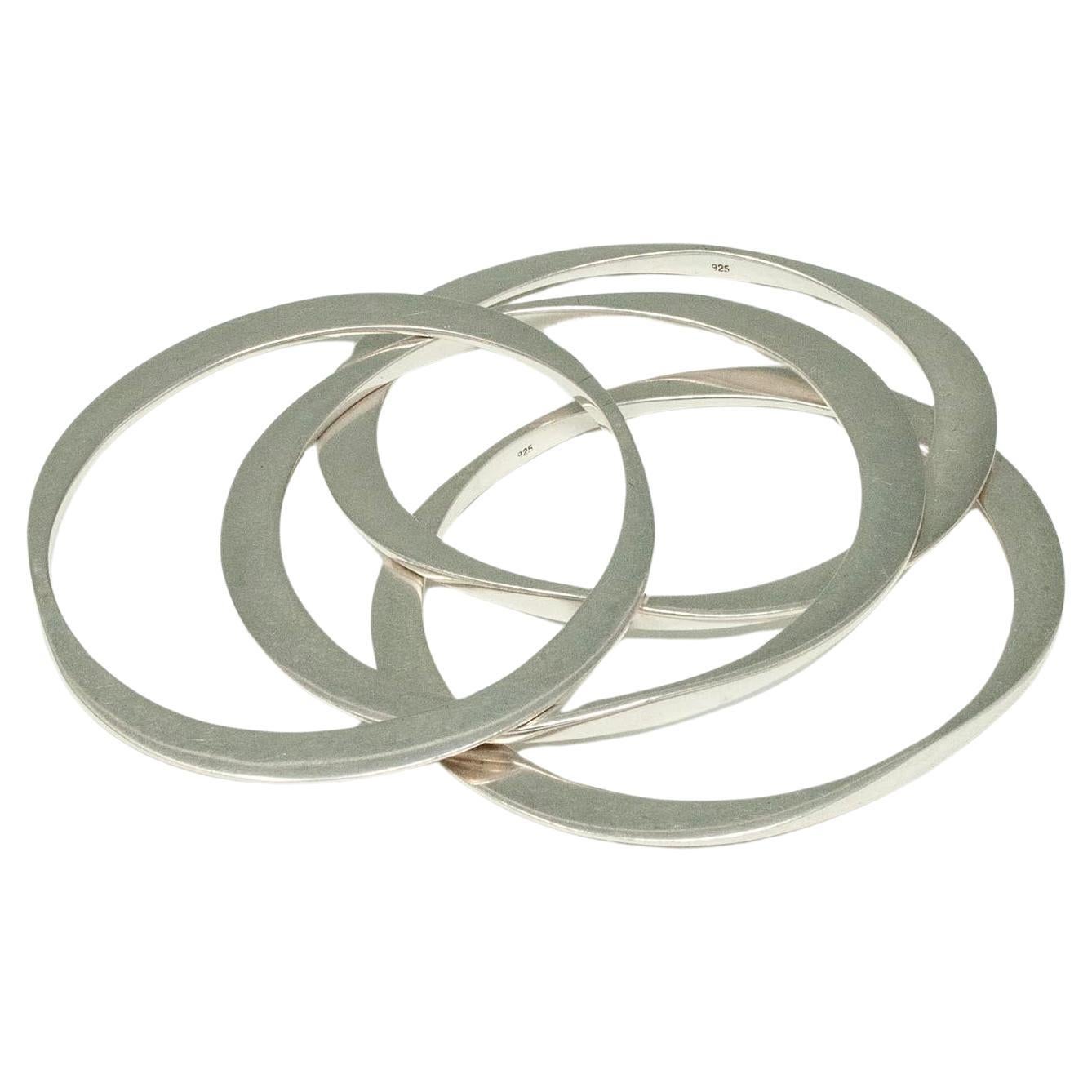 Four Modern Silver Oval Bangle Bracelets