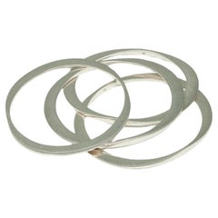 Four Modern Silver Oval Bangle Bracelets