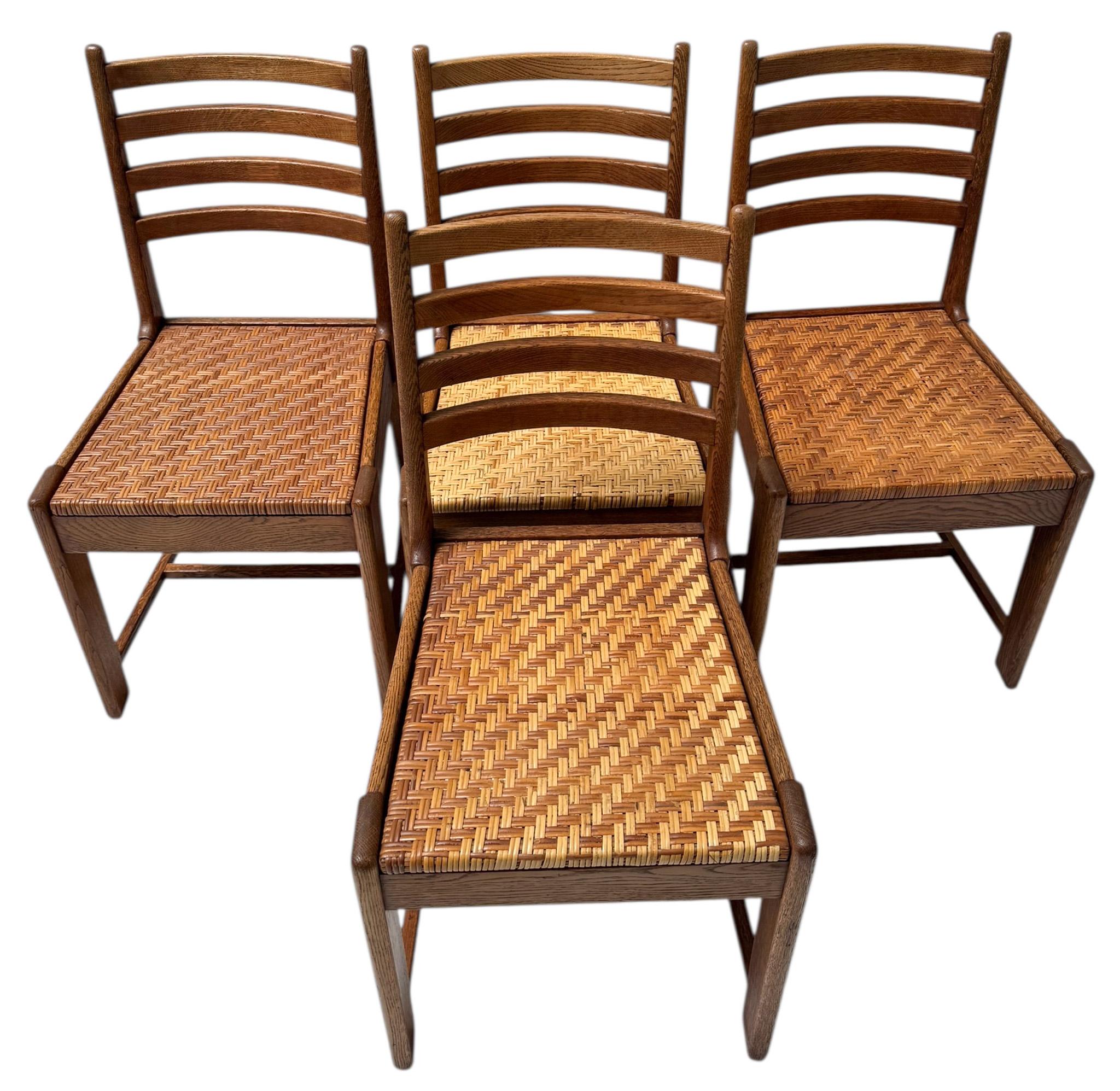 Magnificent and rare set of four of Modernist Art Deco dining room chairs.
Design by Bas van Pelt for My Home Den Haag.
Striking Dutch design from the 1930s.
Solid oak frames with original rattan seats.
Two of the four are marked with the original