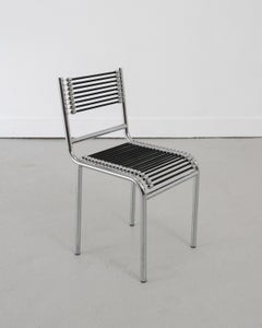 Quatre chaises « Sandows » modernistes à structure tubulaire, signées René Herbst, vers 1980