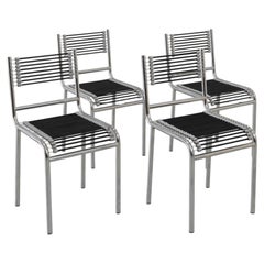 Quatre chaises « Sandows » modernistes à structure tubulaire, signées René Herbst, vers 1980