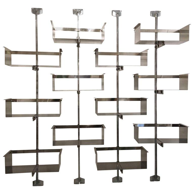 Four modular wall-mounted shelving system designed by Vittorio Introini, produced by Saporiti, Italy, circa 1969.
Stainless steel, very good condition. 
Shelves can be used individually or combined together in many different ways
4 shelves for each