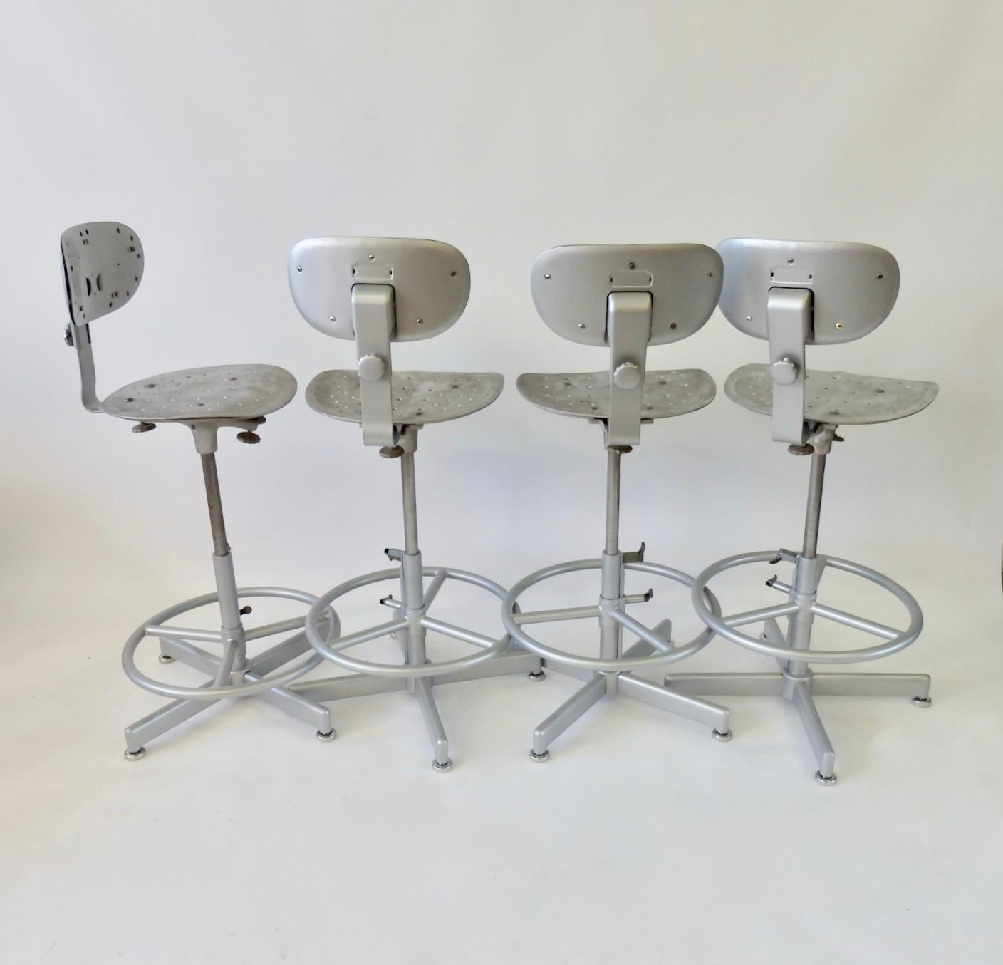 Four Multi Adjustable Industrial Operators Swivel Bar or Counter Stools In Good Condition In Ferndale, MI