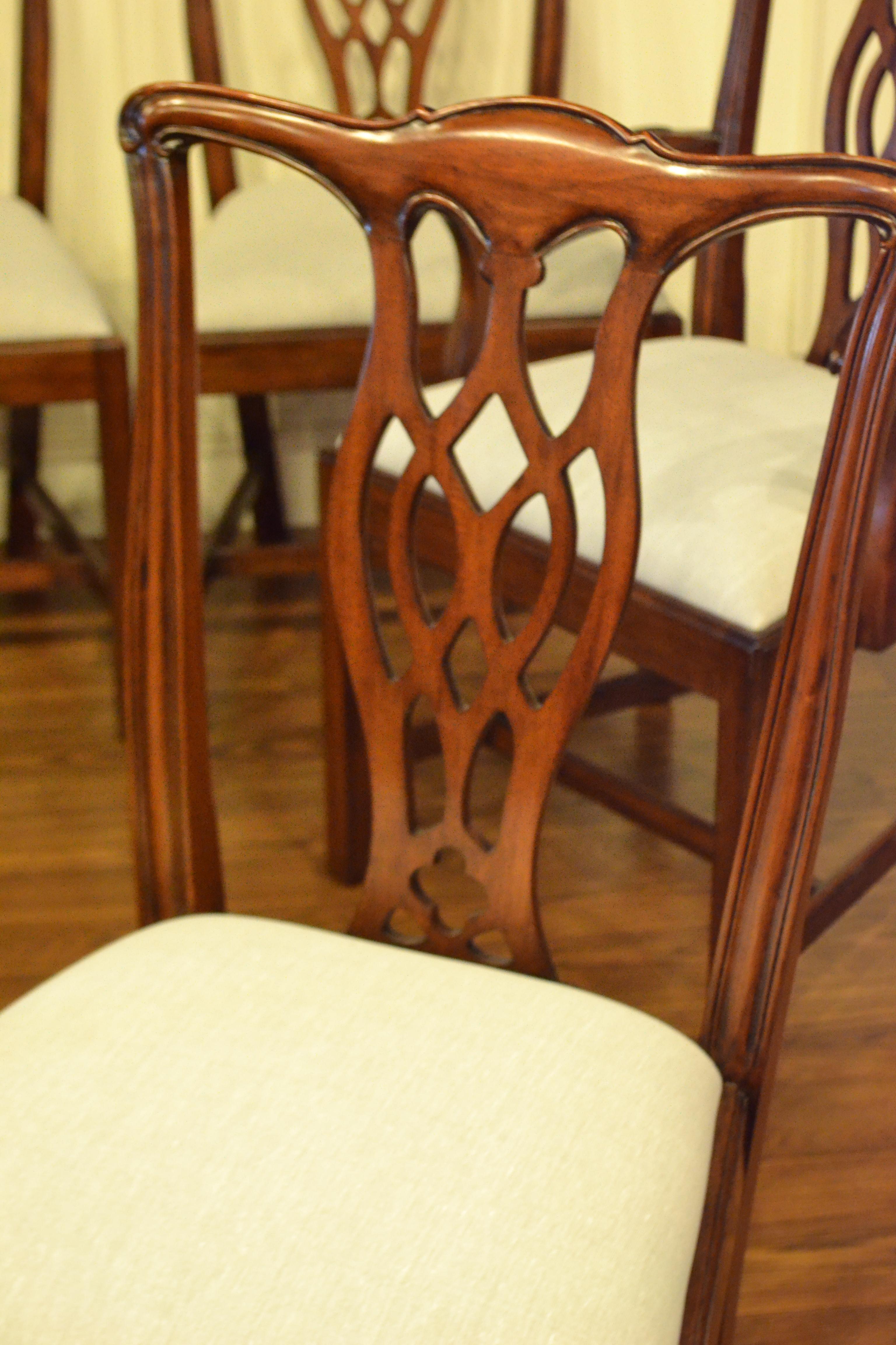 These are a set of four new traditional mahogany dining chairs. Their design was inspired by the early English Chippendale style straight leg dining chairs from the Georgian period. They feature classic early Chippendale styling with less carvings