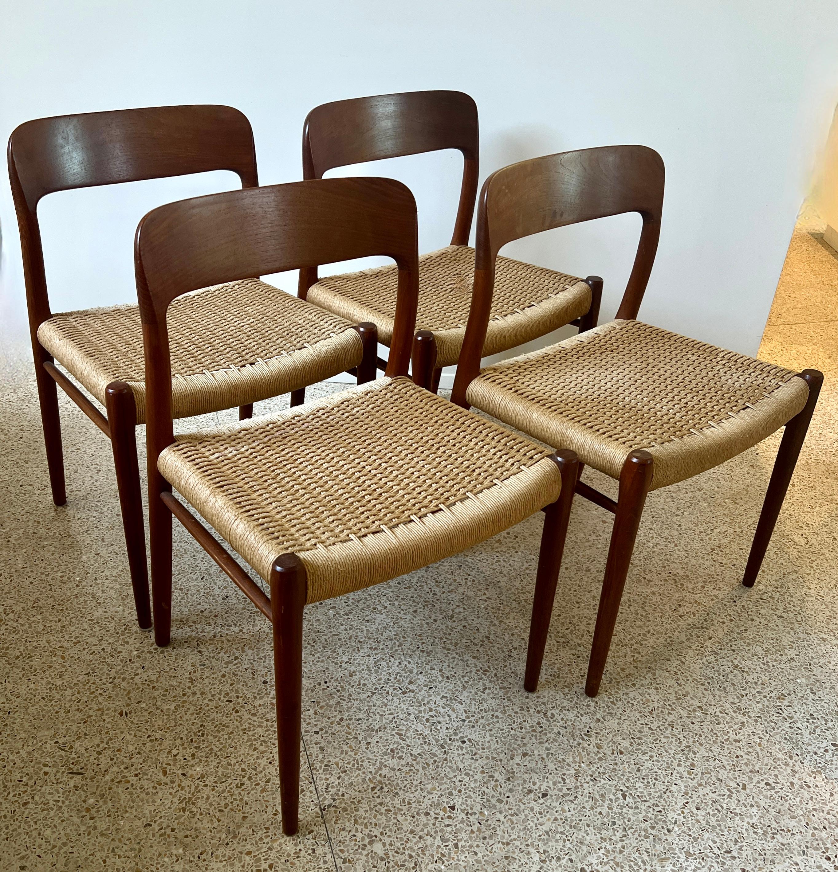 A set of four Danish Modern Dining or occasional Chairs by Niels Otto Moller 

The design is classic Danish Sleek and modern with intricate hand crafted and hand woven Papercord seats.

A compliment to any Mid Century Modern home as a dining chair,