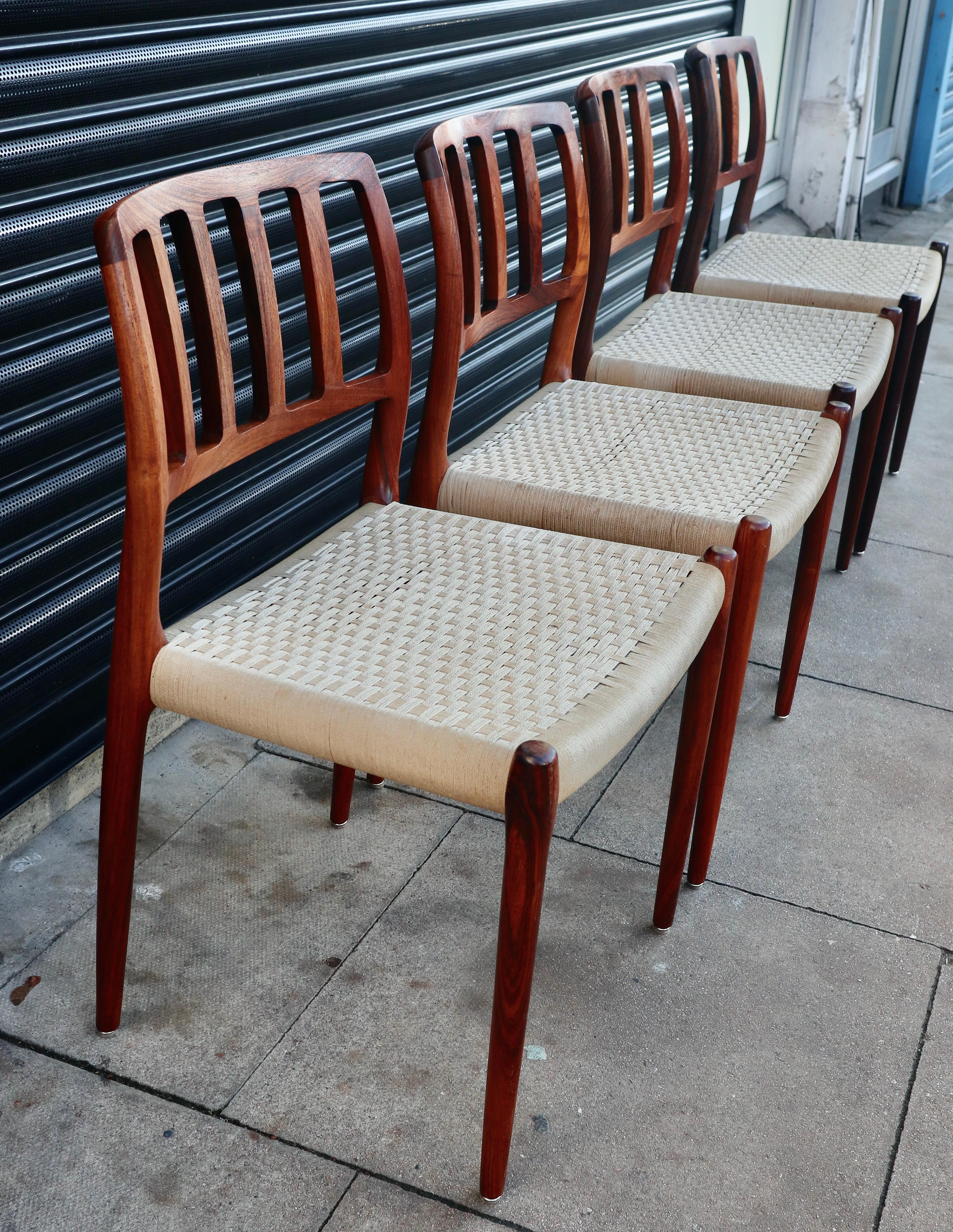 Danish Four Niels.O Moller 83 Rosewood Dining Chairs by J.L. Mollers with woven Seats For Sale