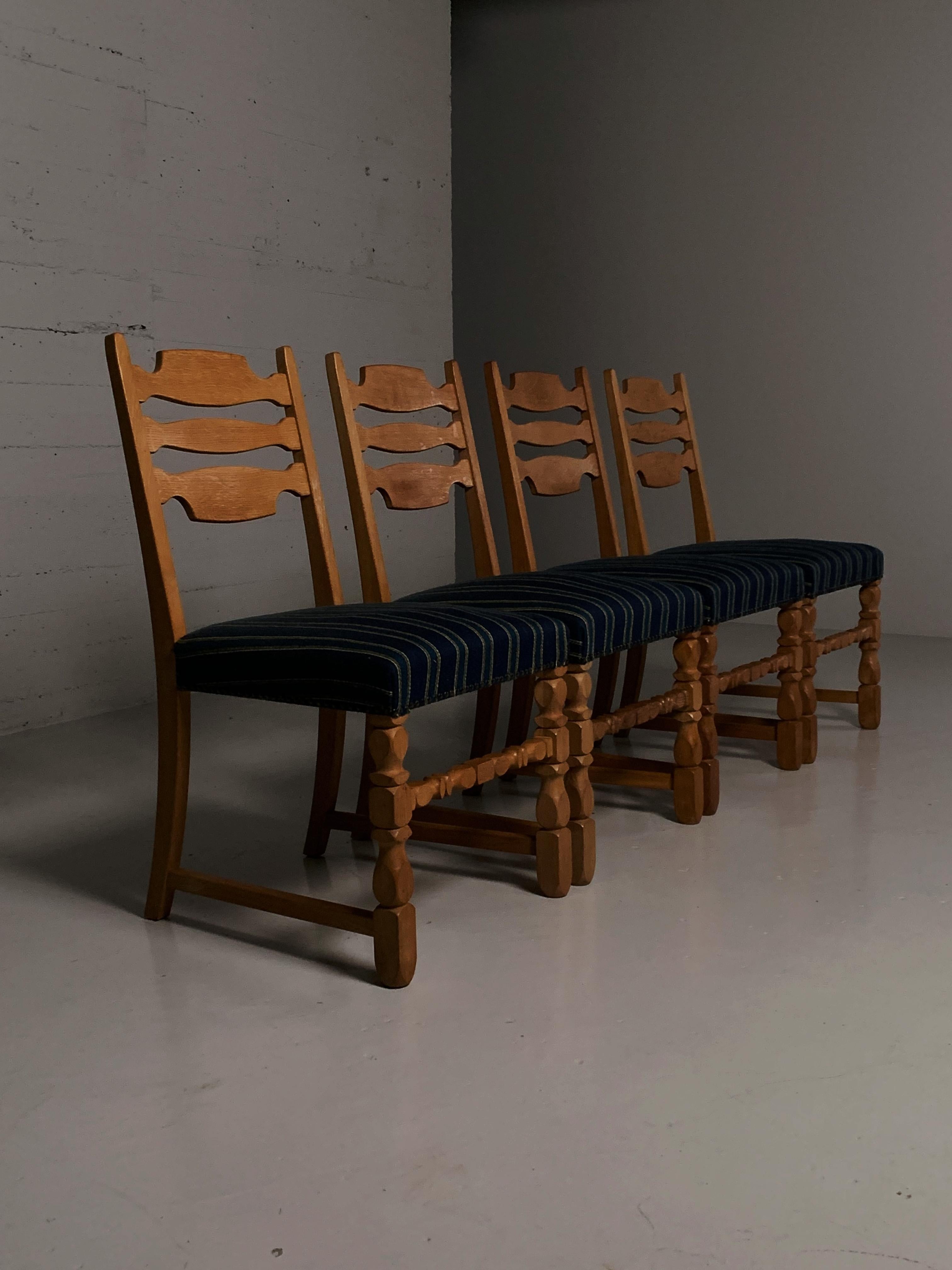 Scandinavian Modern Four oak dining chairs in the style of Henning Kjærnulf, Denmark, 1960s For Sale