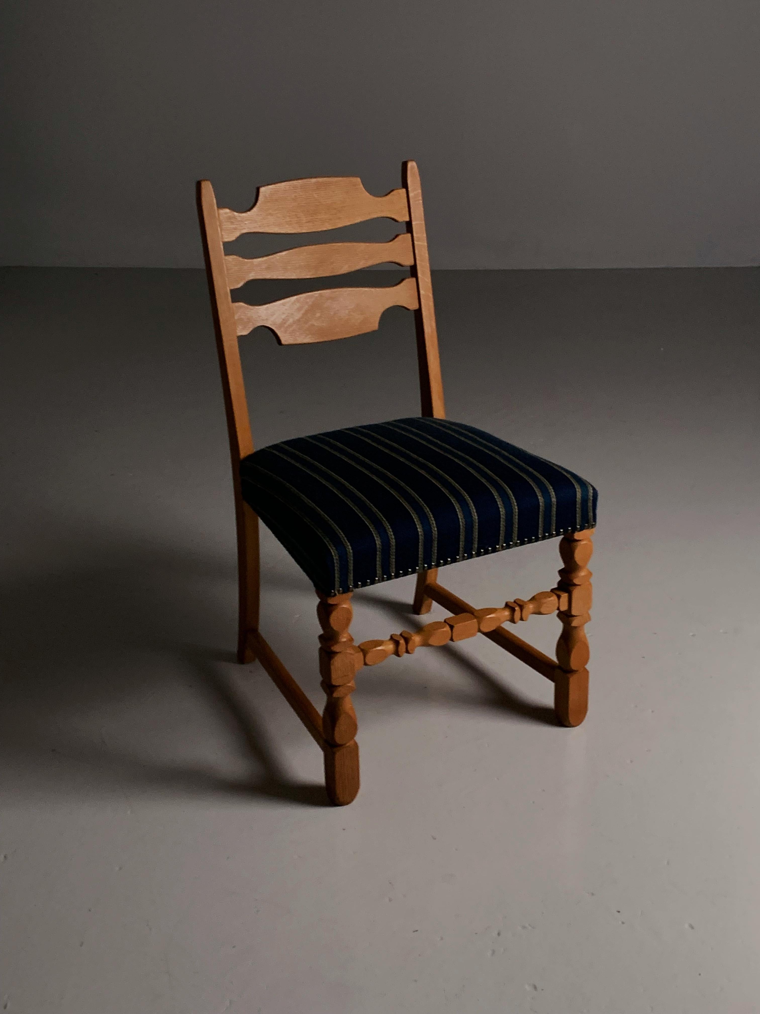 Danish Four oak dining chairs in the style of Henning Kjærnulf, Denmark, 1960s For Sale
