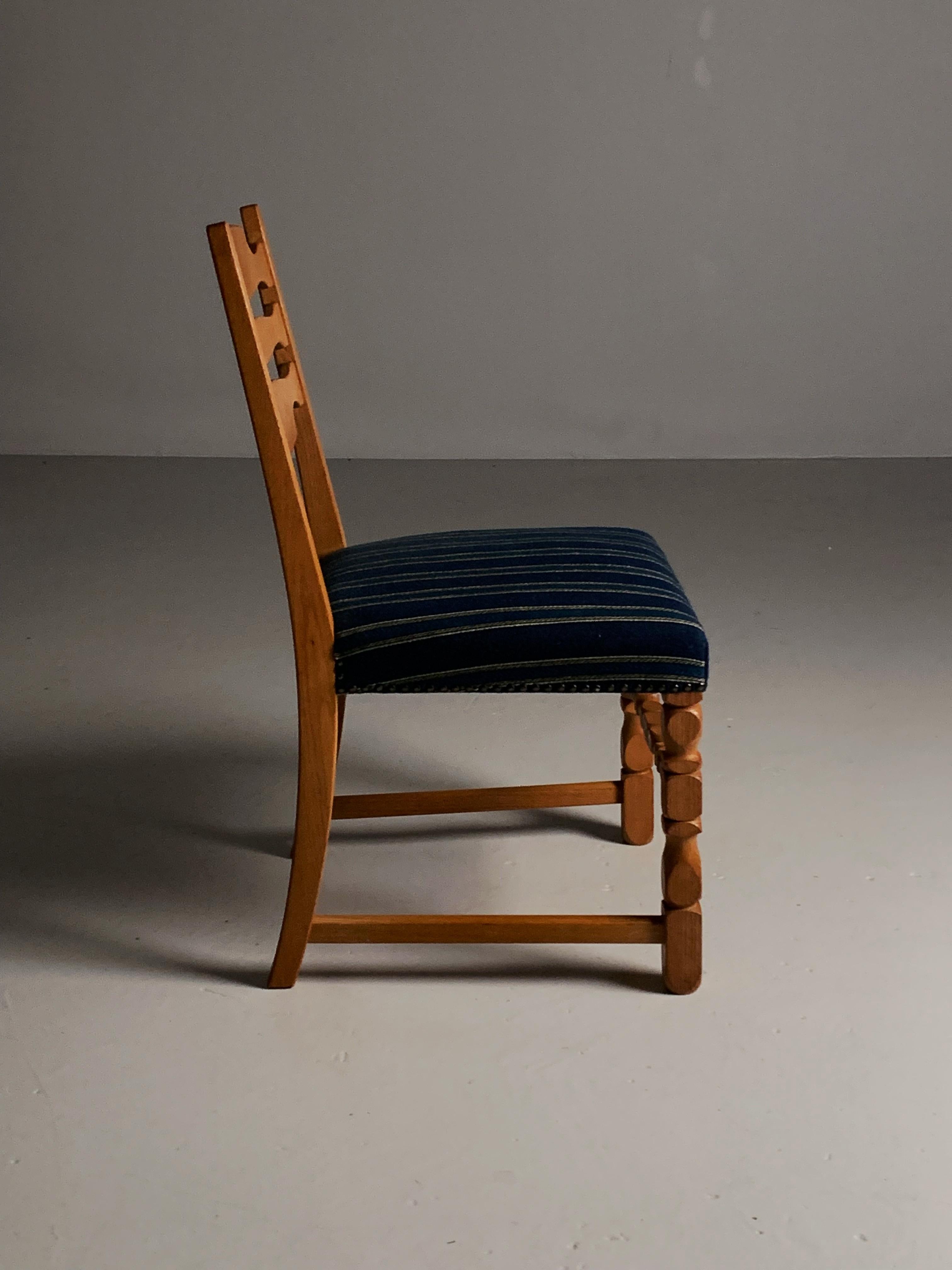 20th Century Four oak dining chairs in the style of Henning Kjærnulf, Denmark, 1960s For Sale