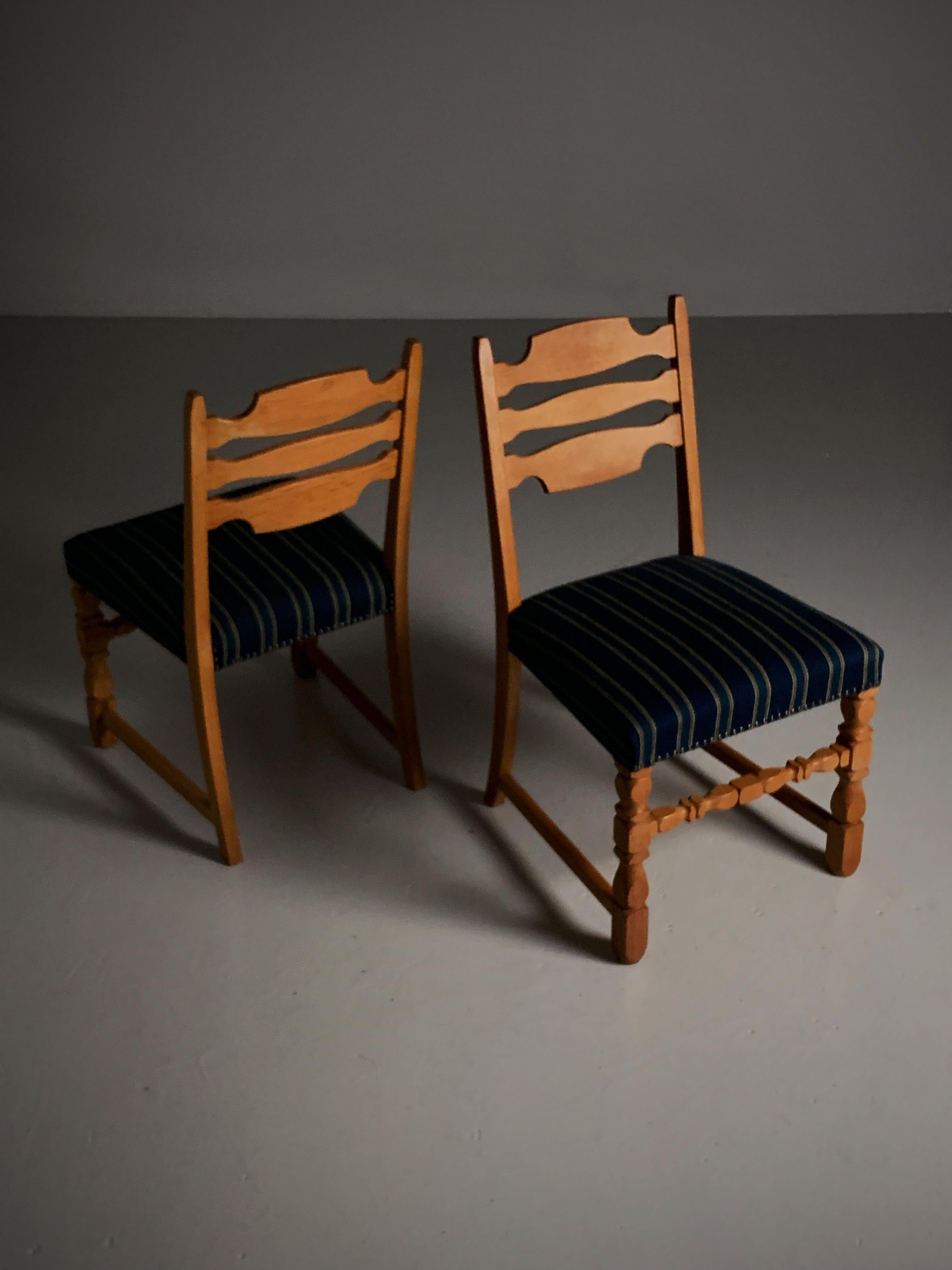 Fabric Four oak dining chairs in the style of Henning Kjærnulf, Denmark, 1960s For Sale