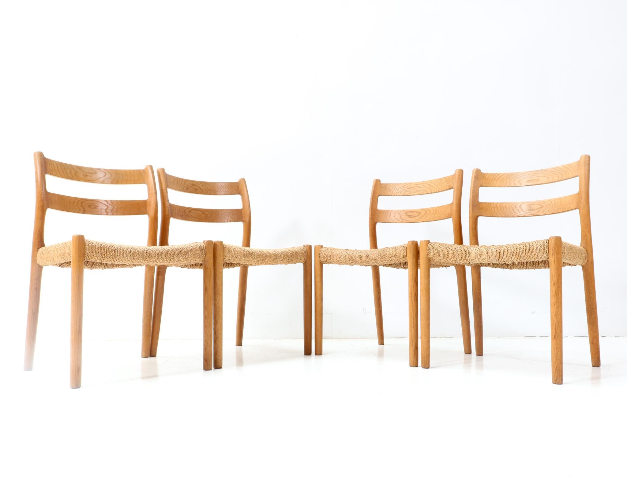 Papercord Four Oak Mid-Century Modern Model 84 Dining Room Chairs by Niels Otto Møller