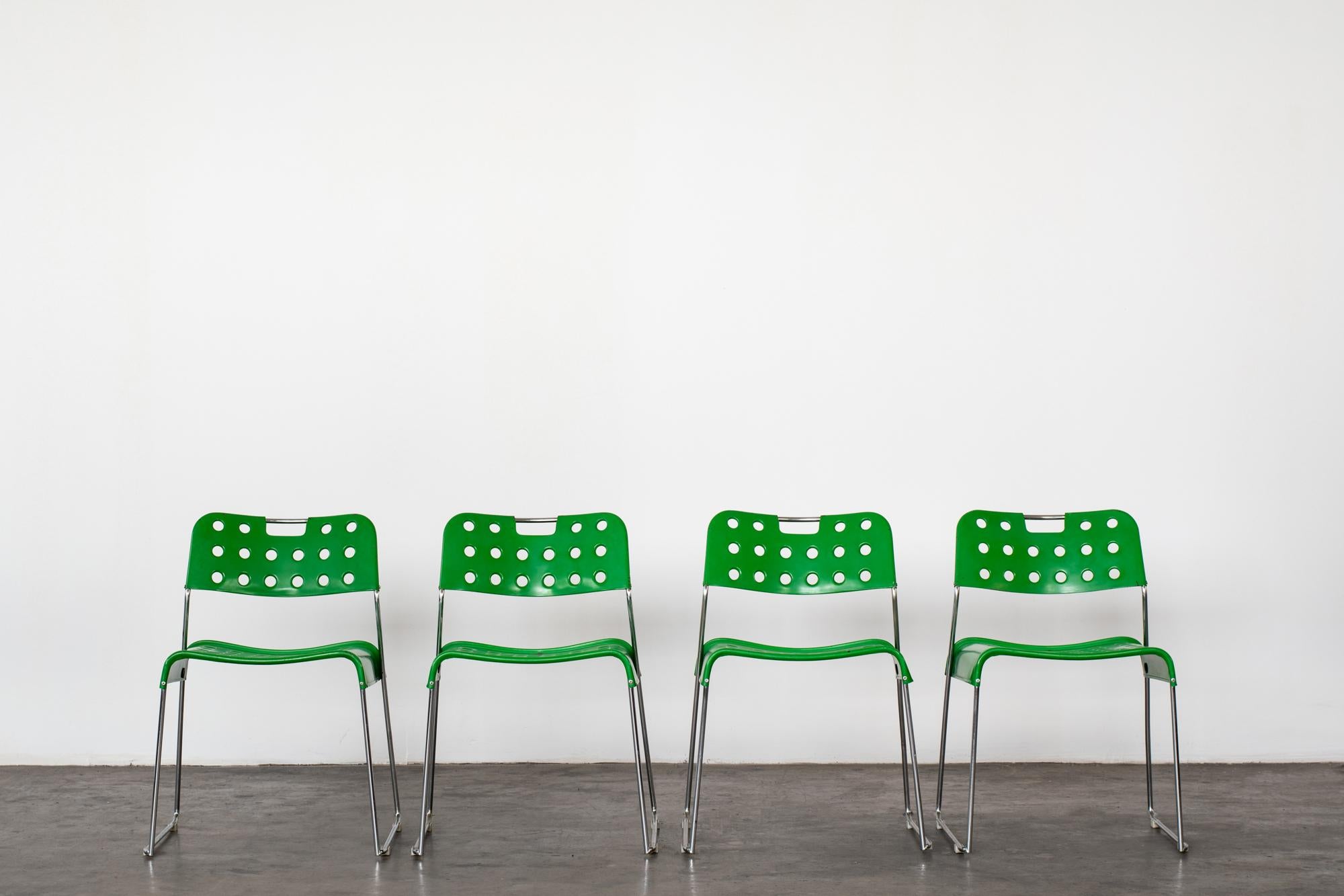 Four 'Omstak' chairs by Rodney Kinsman
Manufactured by BIEFFEPLAST, Italy, 1970.
Chromed steel, enamelled sheet metal.
Measures: Width 56 x Depth 49 x Height 74 Cm

Literature: Giuliana Gramigna, Repertorio 1950-1980, Mondadori, Milano, 1985,