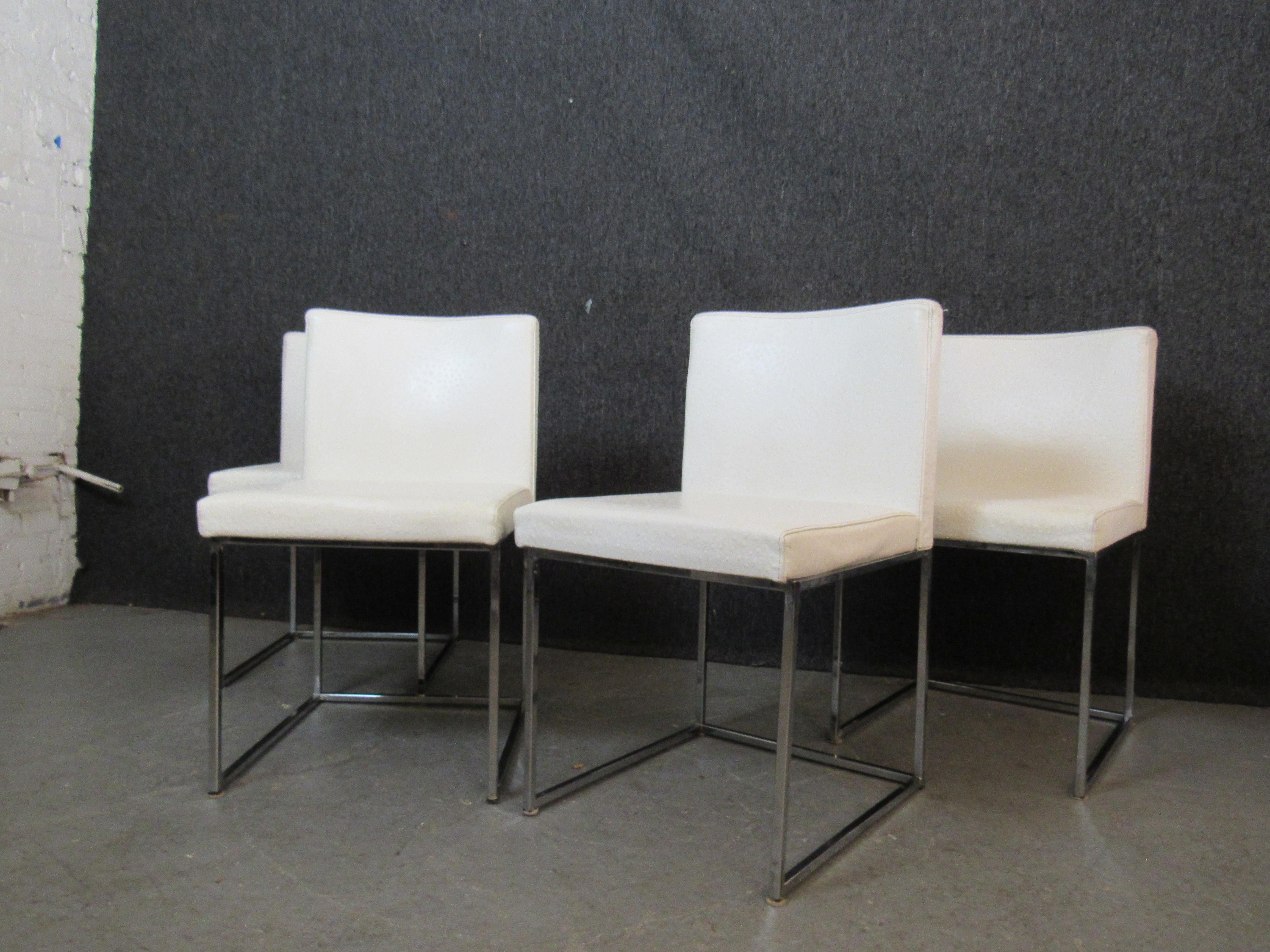 Mid-Century Modern Quatre chaises de salle à manger en cuir d'autruche par Calligaris en vente