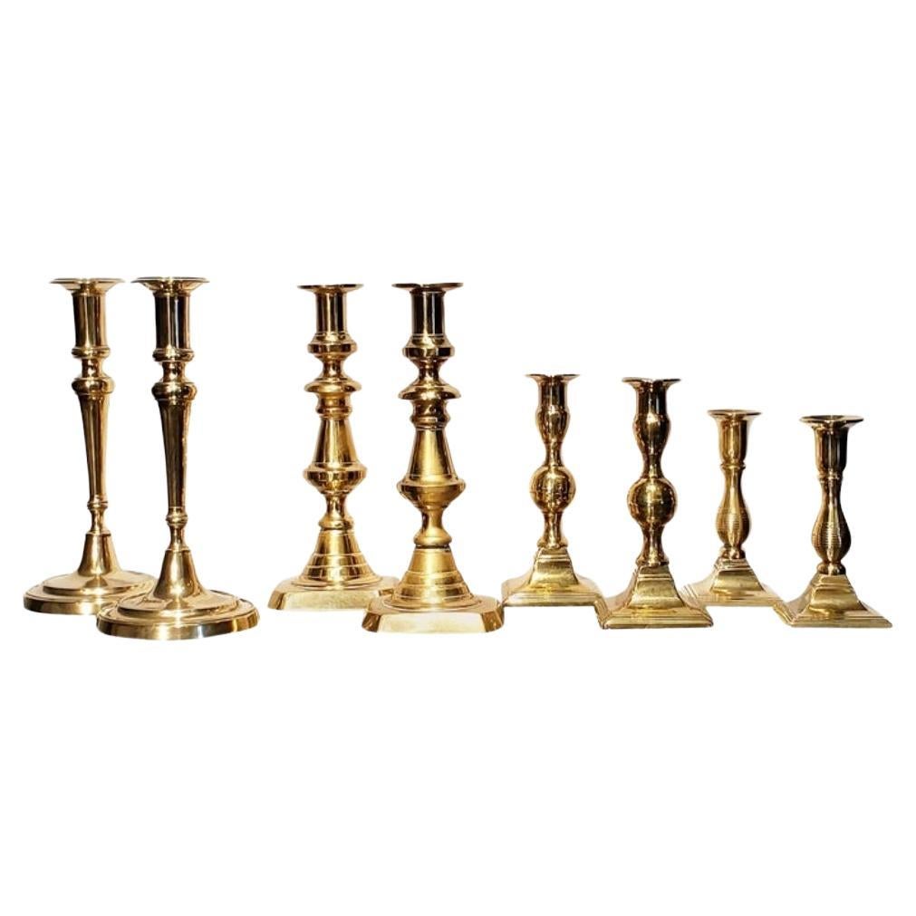 Four Pairs of 19th Georgian Brass Candlesticks