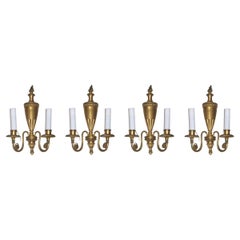 Ensemble de quatre appliques en bronze de style Adam attribuées à Caldwell
