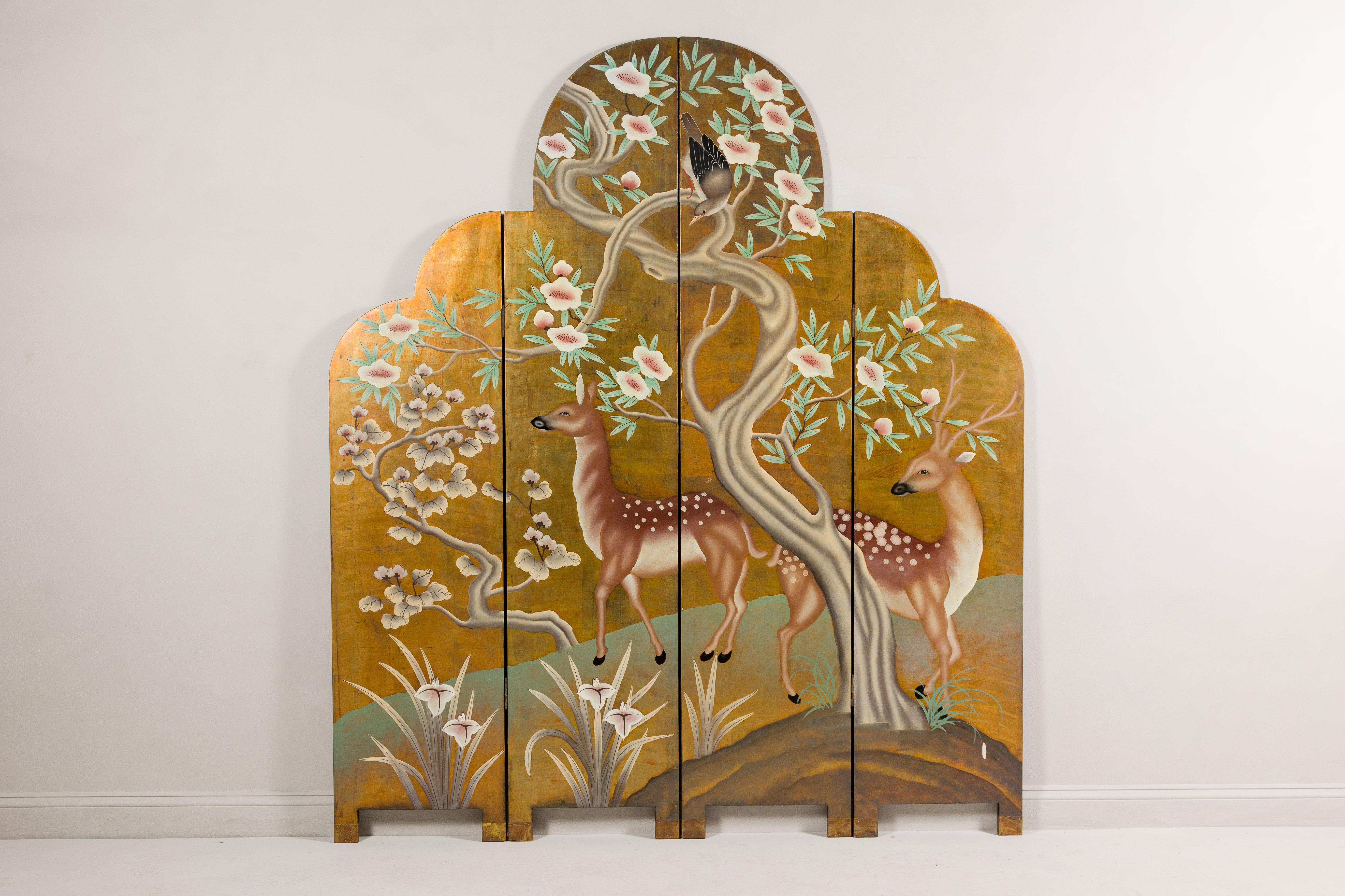 A vintage four-panel gilded wood screen adorned with deer, bird, trees and flowers. This vintage four-panel gilded wood screen is a stunning work of art that transports you into a serene natural landscape. Each panel is a masterpiece, participating