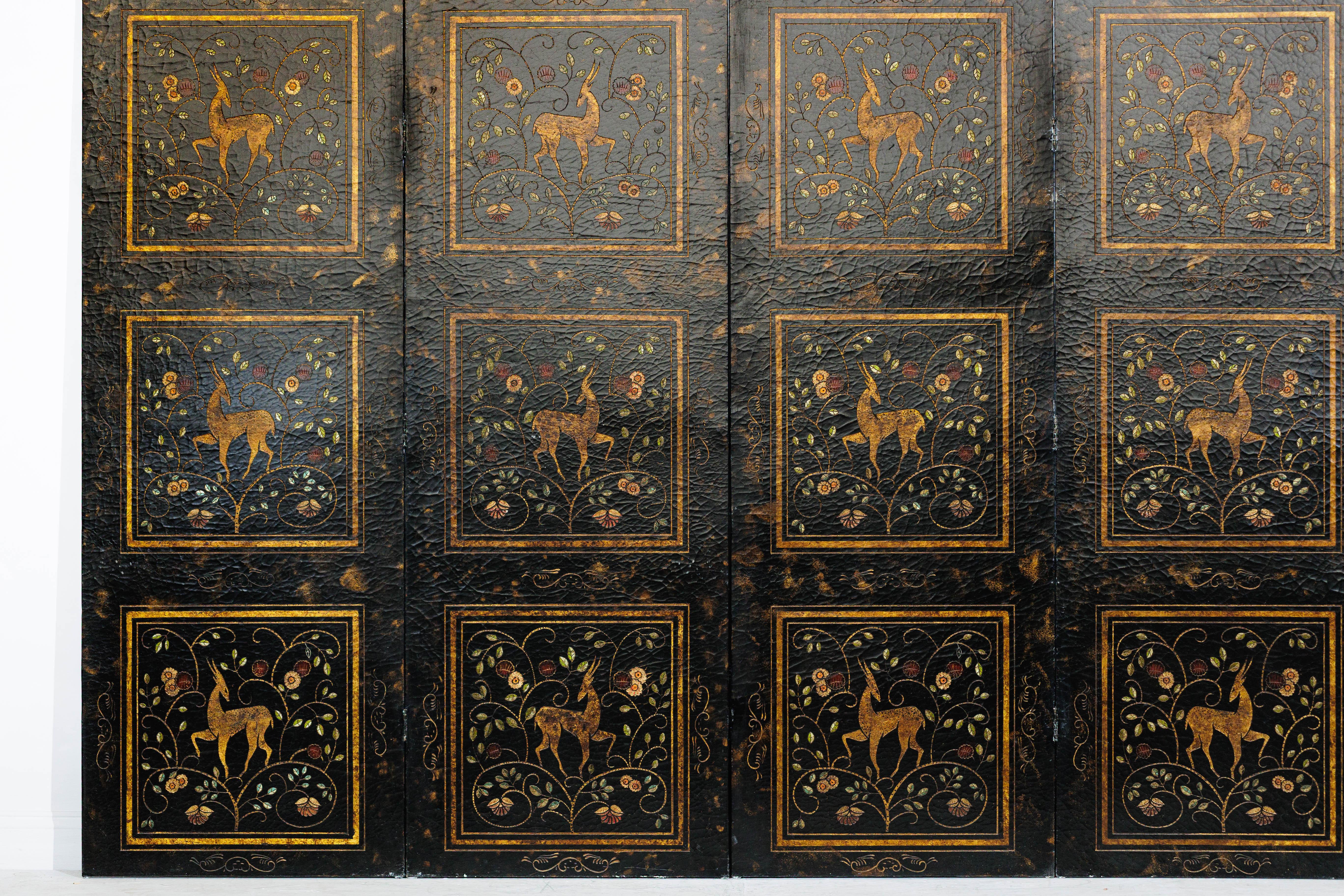 A vintage Chinese four-panel screen, richly decorated in gilt and lacquer with imagery of deer moving gracefully among flowering vines. Each panel is arranged in rectangular reserves, the designs outlined and worked in low relief to give subtle