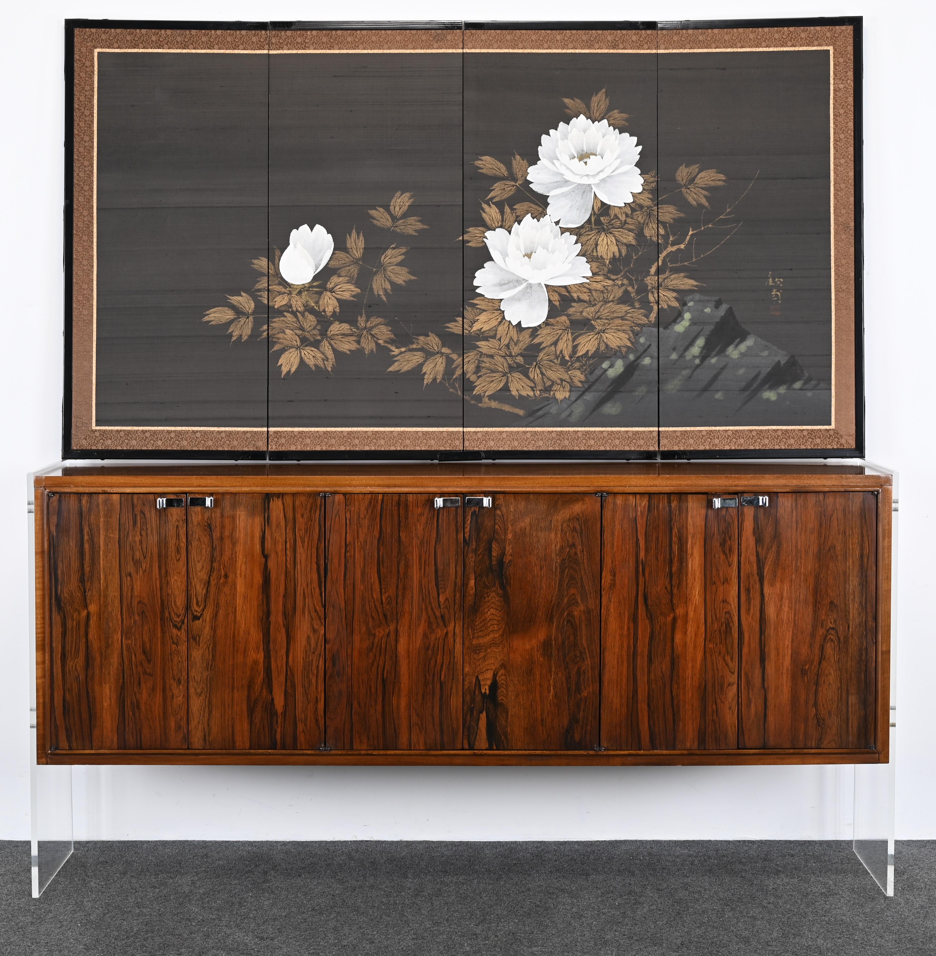 A beautiful Asian 4-panel screen with white lotus flowers, gold decoration, and mountains on silk. Has signature but not able to decipher artist or origin. Most likely Asian, Chinese, or Japanese. Appears to date from the mid-20th Century. Some