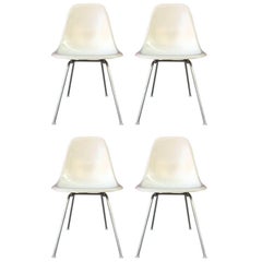 Four Parchment Herman Miller Eames Dining Chairs