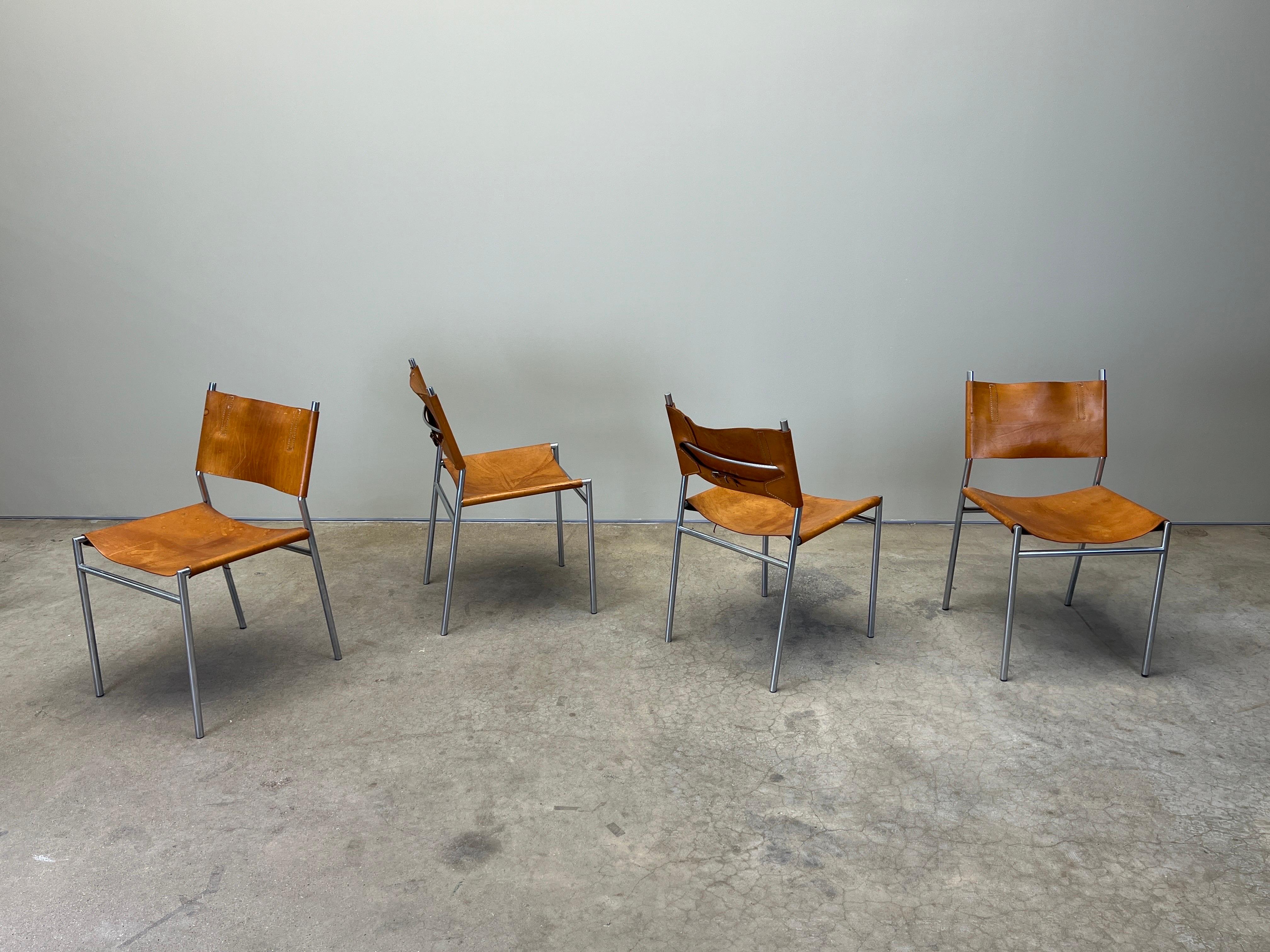 A set of four beautifully patinated brown leather chairs designed by Martin Visser for t Spectrum.