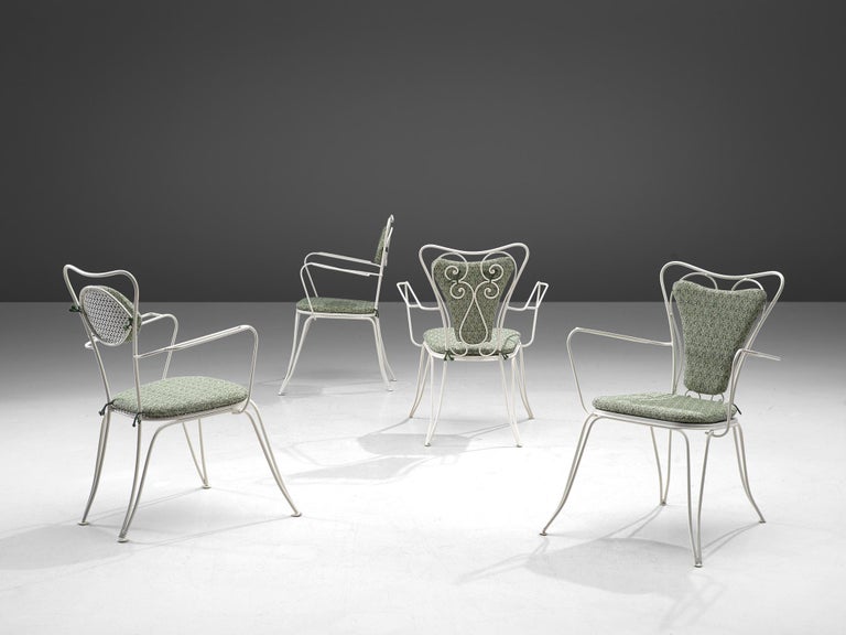 Dining patio chairs, white lacquered metal, fabric, Italy, 1960s.

Elegant chairs in white metal. The chairs have an elegant, bold design, as is quintessential of Italian patio chairs. Curved shapes and thin armrests form the frame combined with a