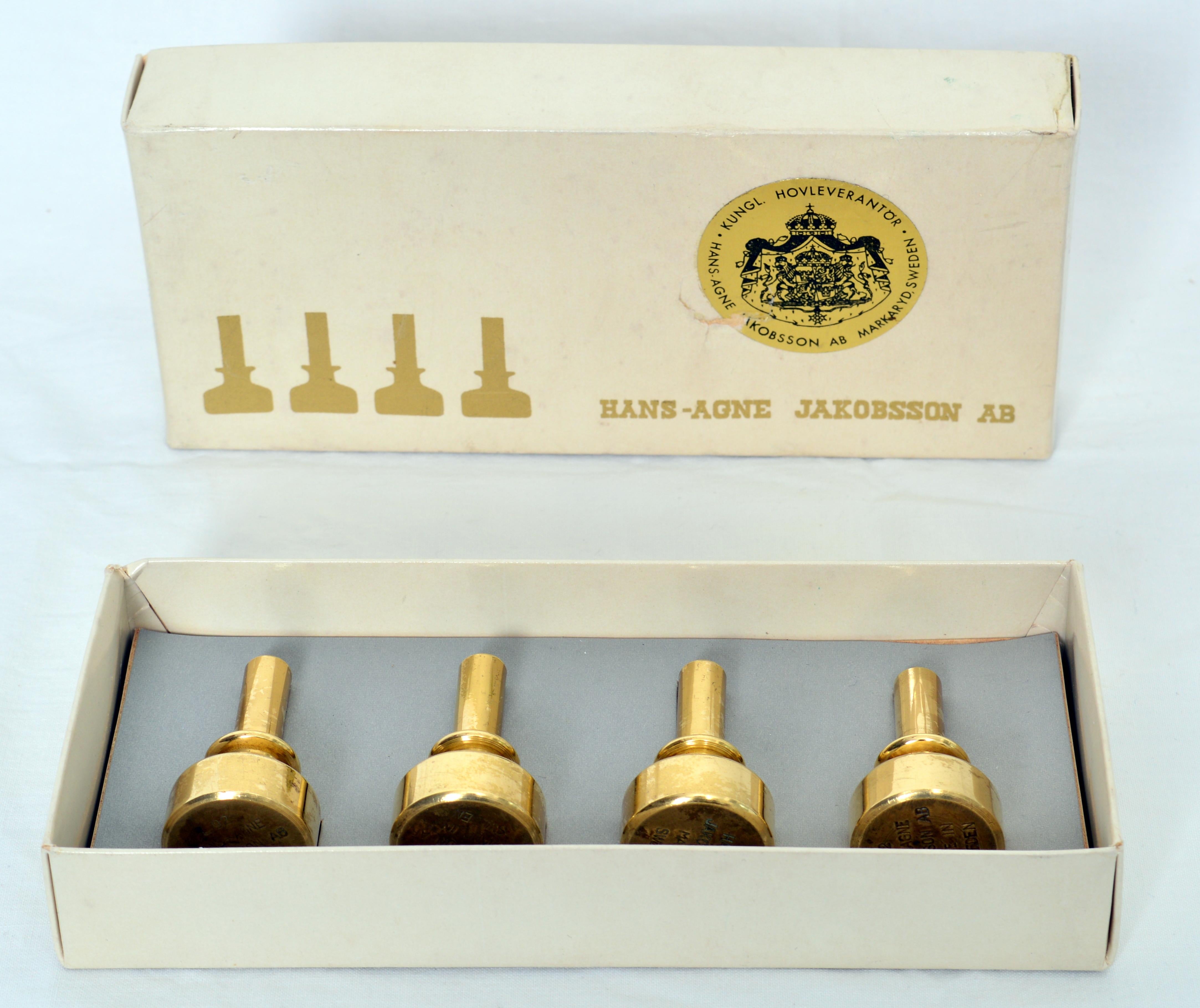 Four small candleholders in solid brass designed by Hans-Agne Jakobsson, Original box included. model “Strix” L92. 
  