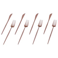 Four-person modernist dinner cutlery set in brass. Late 20th C.