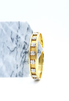 Four Petal Flower Diamond Motif Bangle in 18 Karat Yellow Gold