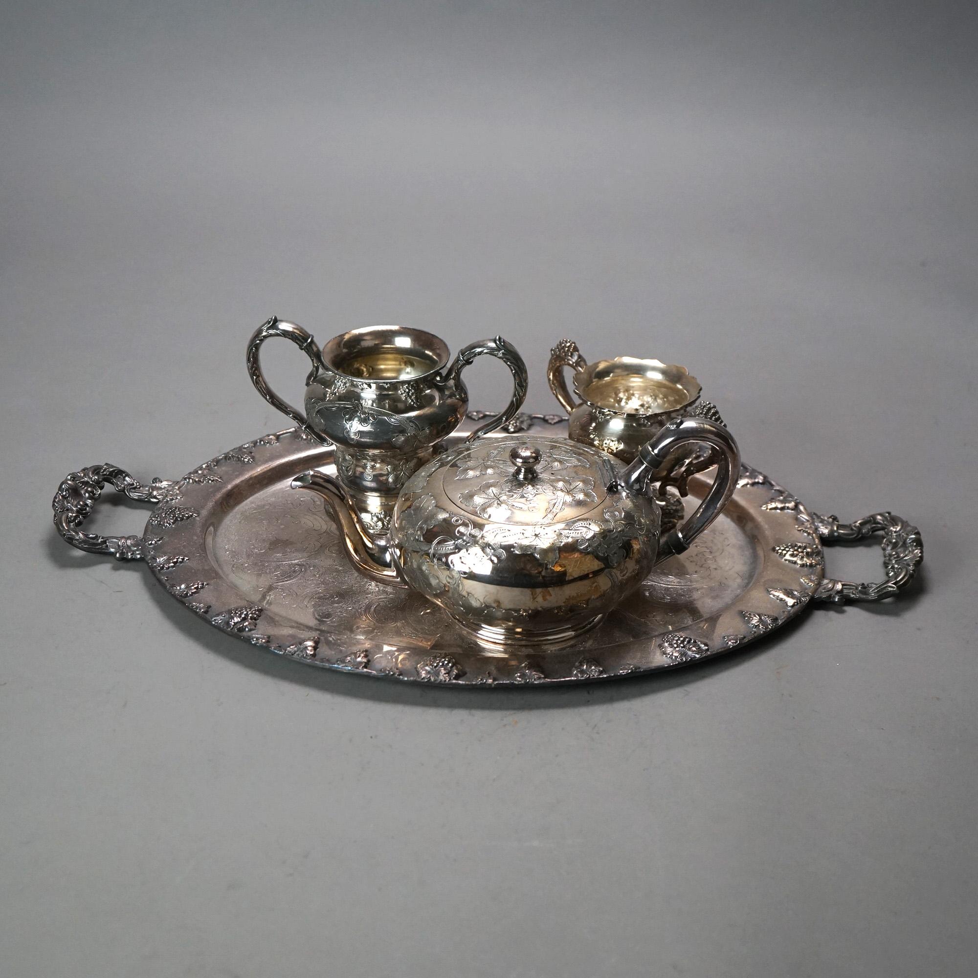 Servizio da tè antico in argento placcato in quattro pezzi con incisioni floreali e fogliate C1890

Misure - 5,25 