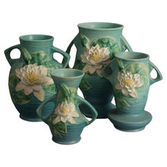 Four Piece Blue Roseville Art Pottery, Water Lily in Green, Mid 20thC