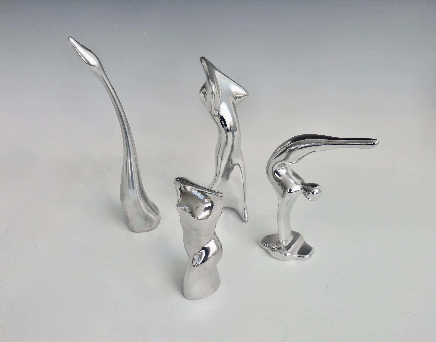 Mid-Century Modern Four Piece Collection of Polished Aluminum Stylized Figures by Hoselton