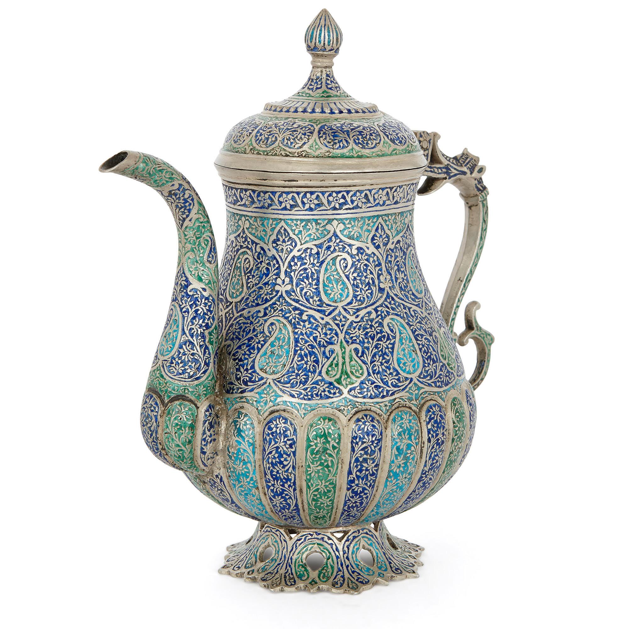 This exquisite tea and coffee service was crafted in Kashmir region of India in the 19th Century. The four piece set comprises of a trefoil-shaped tray, upon which stands a large coffee pot, a slightly smaller tea pot, and a twin-handled sugar