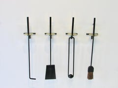 Herramientas de cuatro piezas para chimenea de pared Mel Bogart