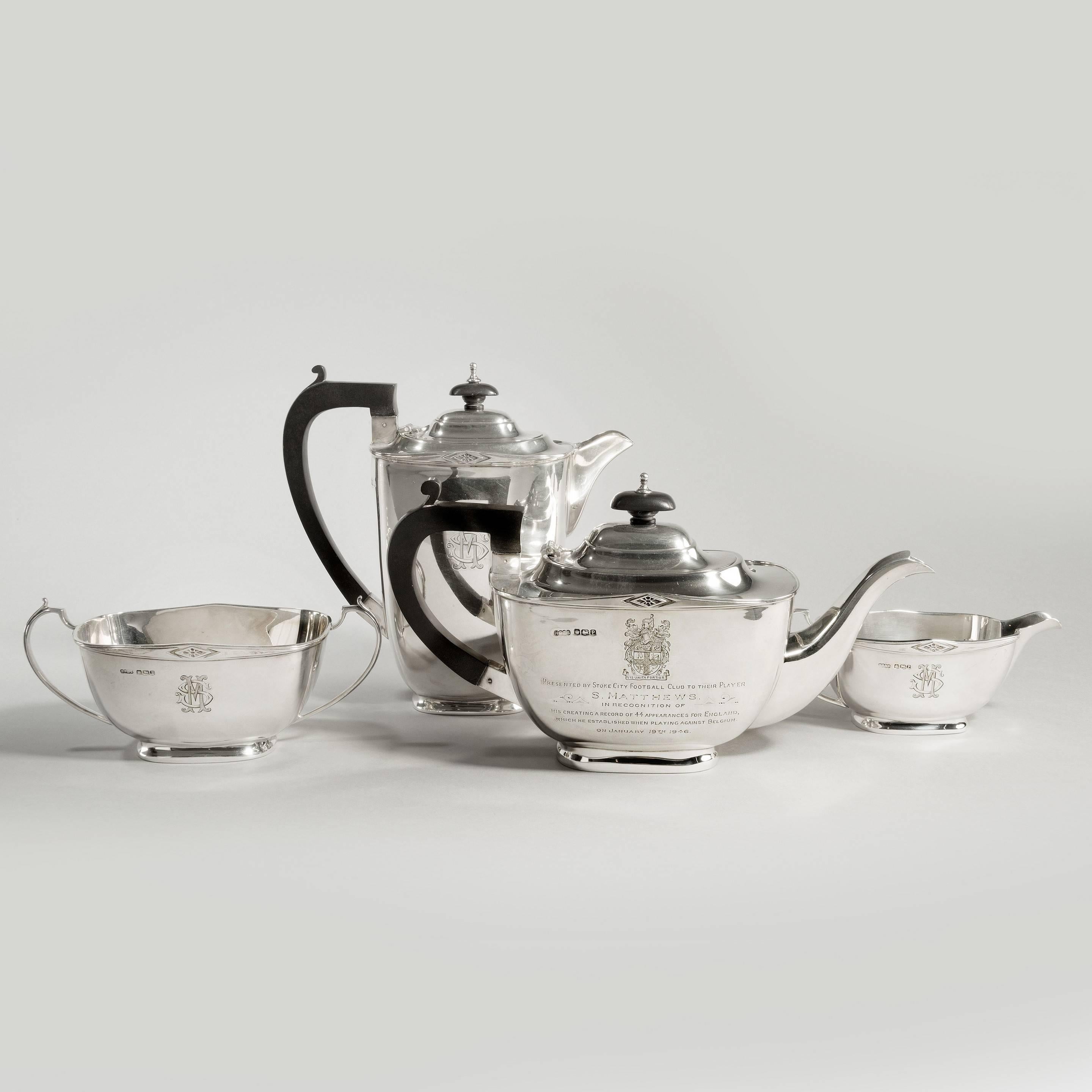 A four-piece silver tea set of football importance,

presented to Stanley Matthews, H Pidduck & Sons Sheffield, 1932, of ovoid shape, the rims inset with geometric forms, each piece inscribed with an S M monogram, the teapot inscribed with the