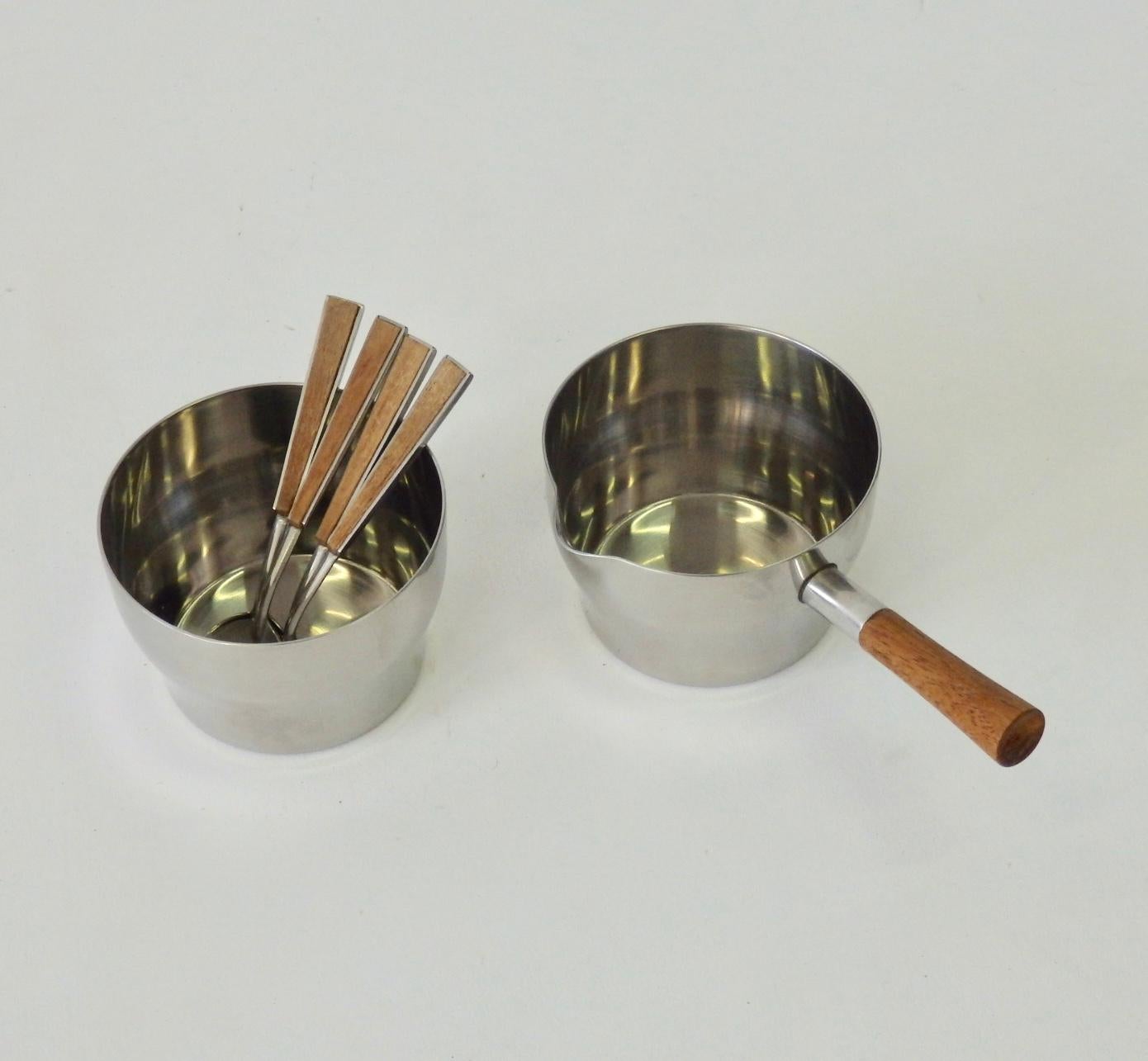 Four piece Dana DFA coffee cocoa or tea service with four teak handle demitasse spoons. Stainless pot with teak side handle, creamer also teak side handle, sugar bowl and tray. All have machine turned underside.